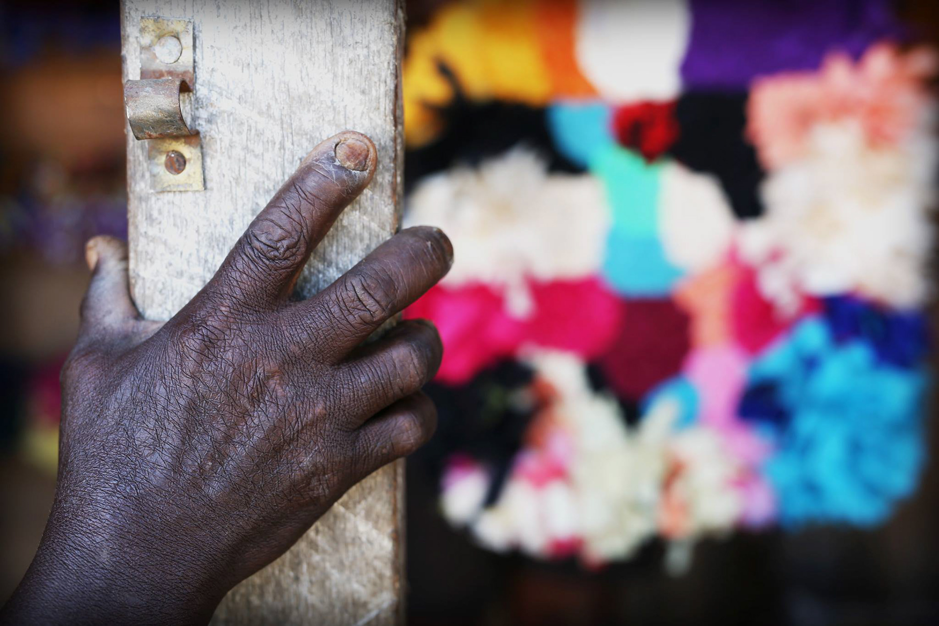 Midwife's hand in Dar es Salaam slum, 2018