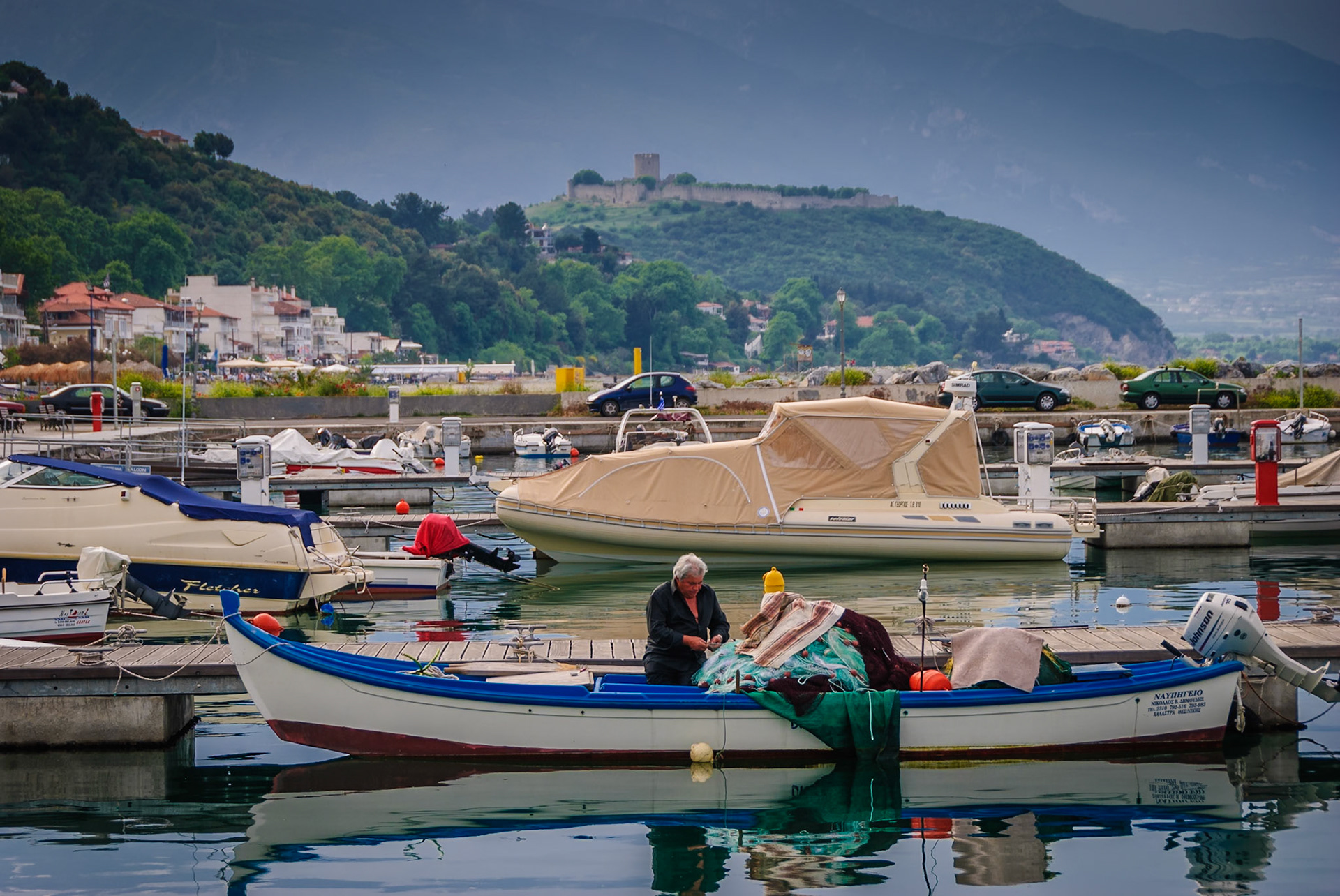Fisherman mending his nets