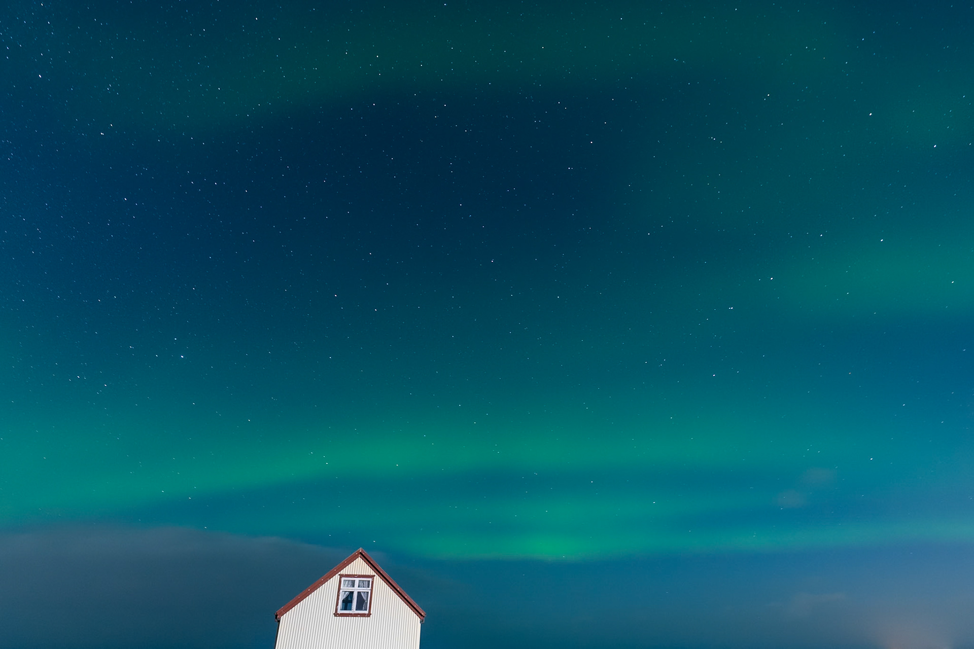 The Northen Lights (aurora borealis) from Kálfatjarn Church