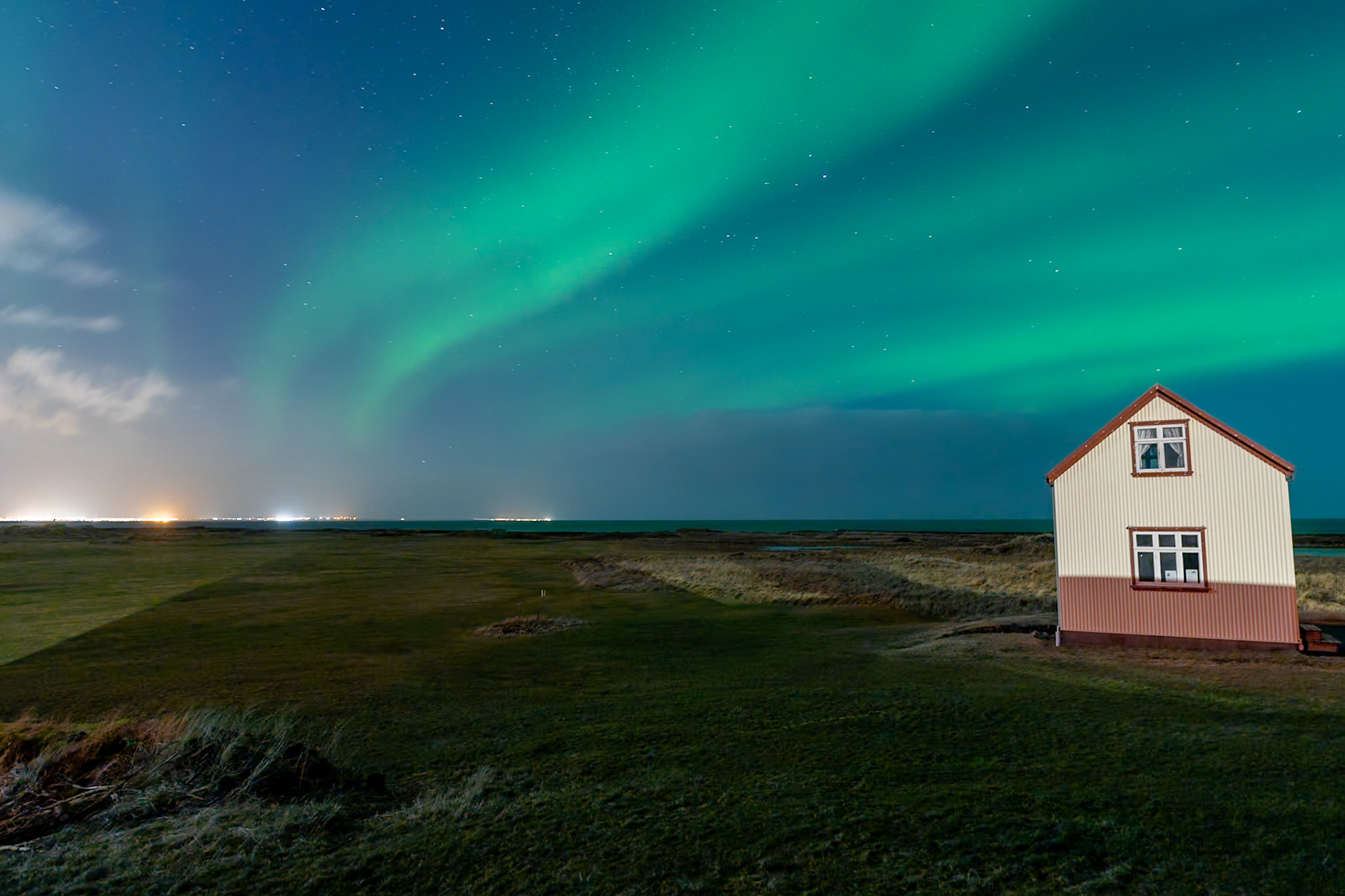 The Northen Lights (aurora borealis) from Kálfatjarn Church