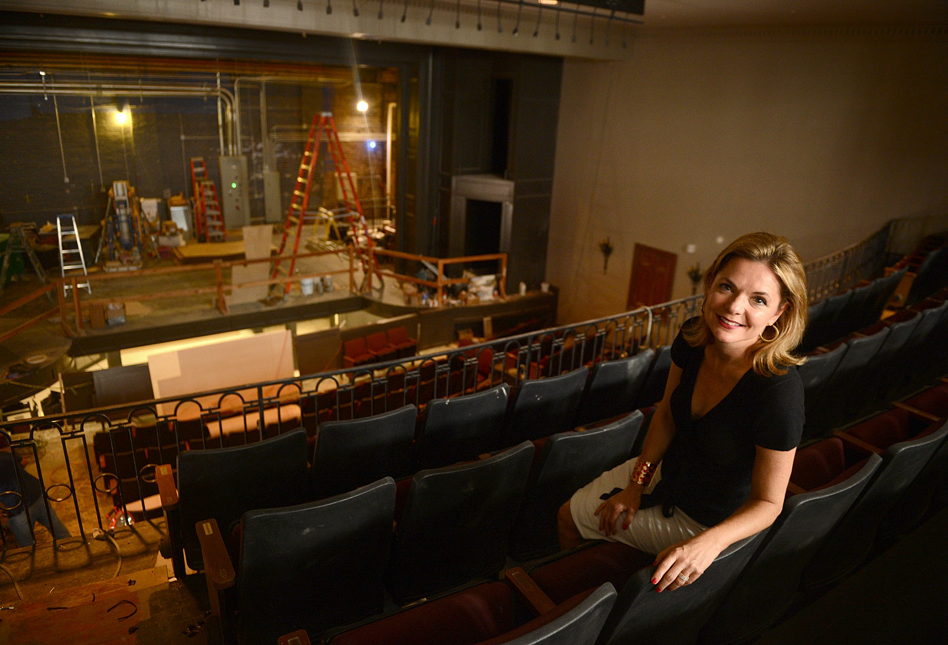 Le Petit Theatre executive director Cassie Worley sits in the balcony as renovation continues.
