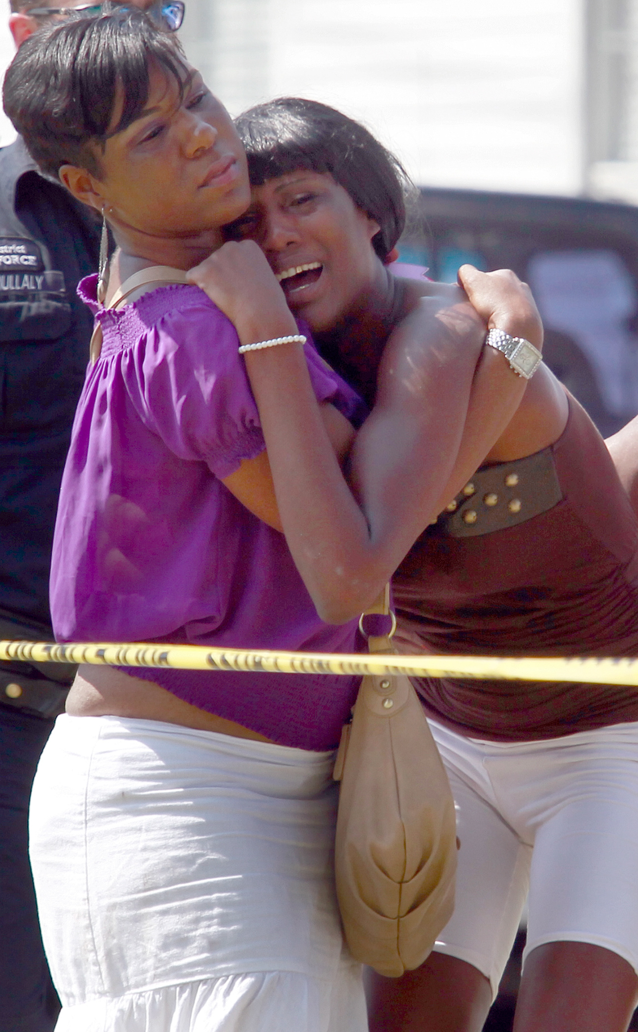 A relative reacts to learning the victim of a homicide is a family member.