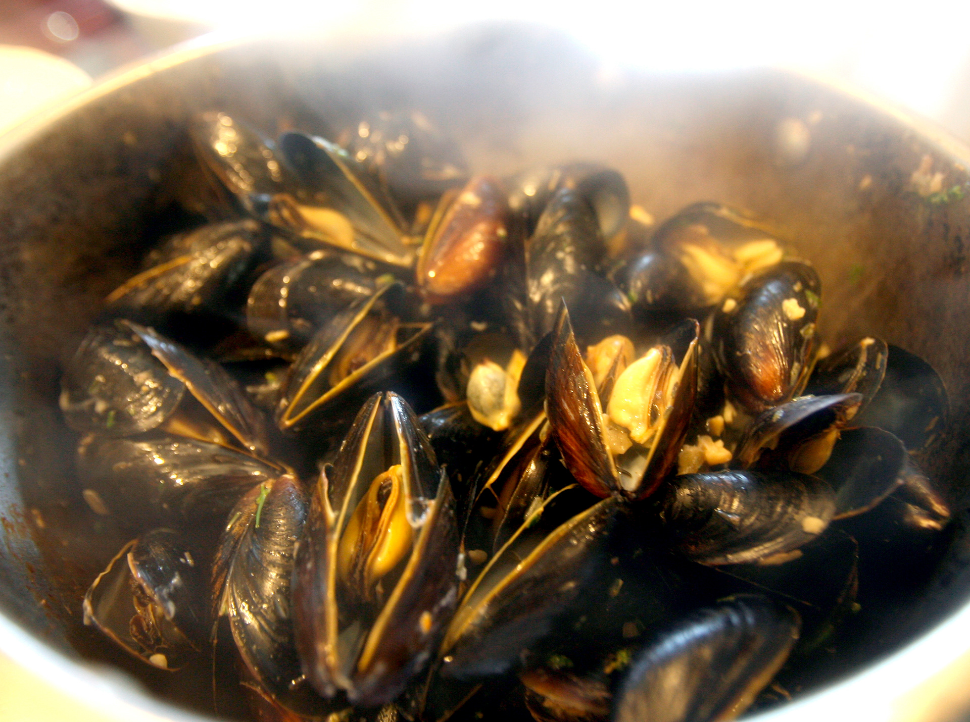 Dan Ness & Sam Prokop are "Deux Papas" at their booth, making Moules Frites (mussels and fries) during the annual Fete