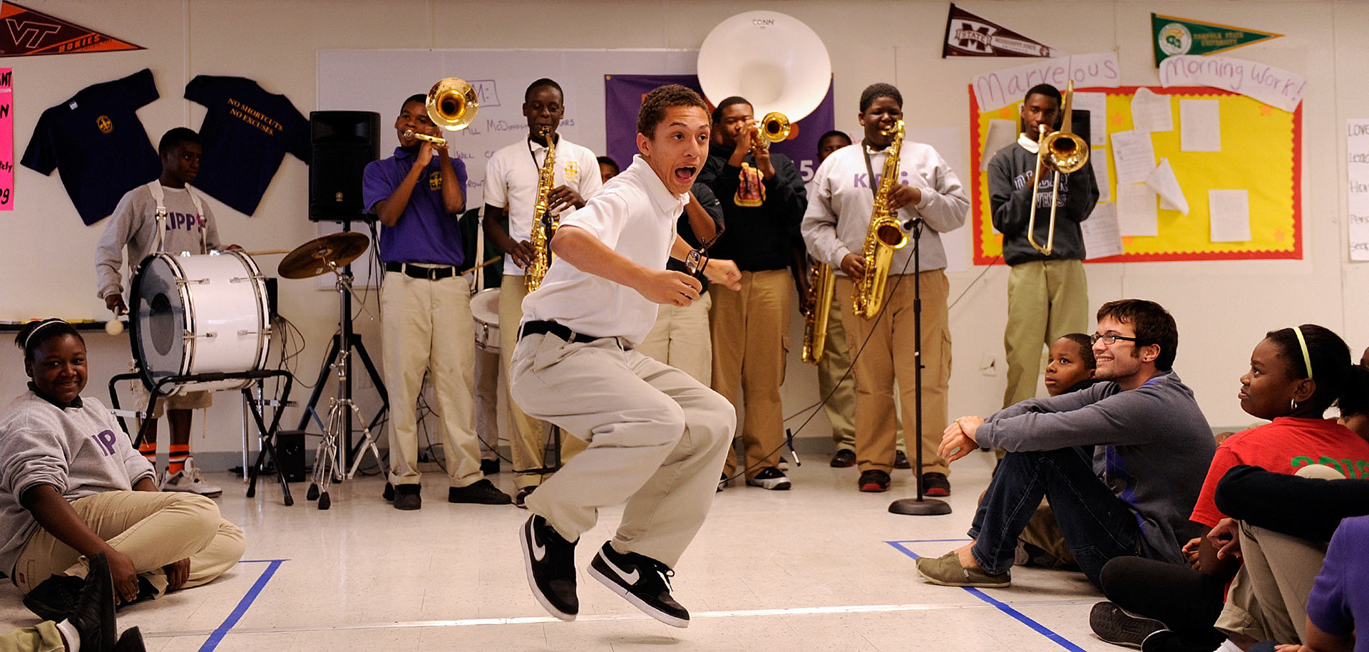 Cameron Wiltz, 15, dances as the KIPP McDonogh 15 Middle School band performs at a school rally Friday,.