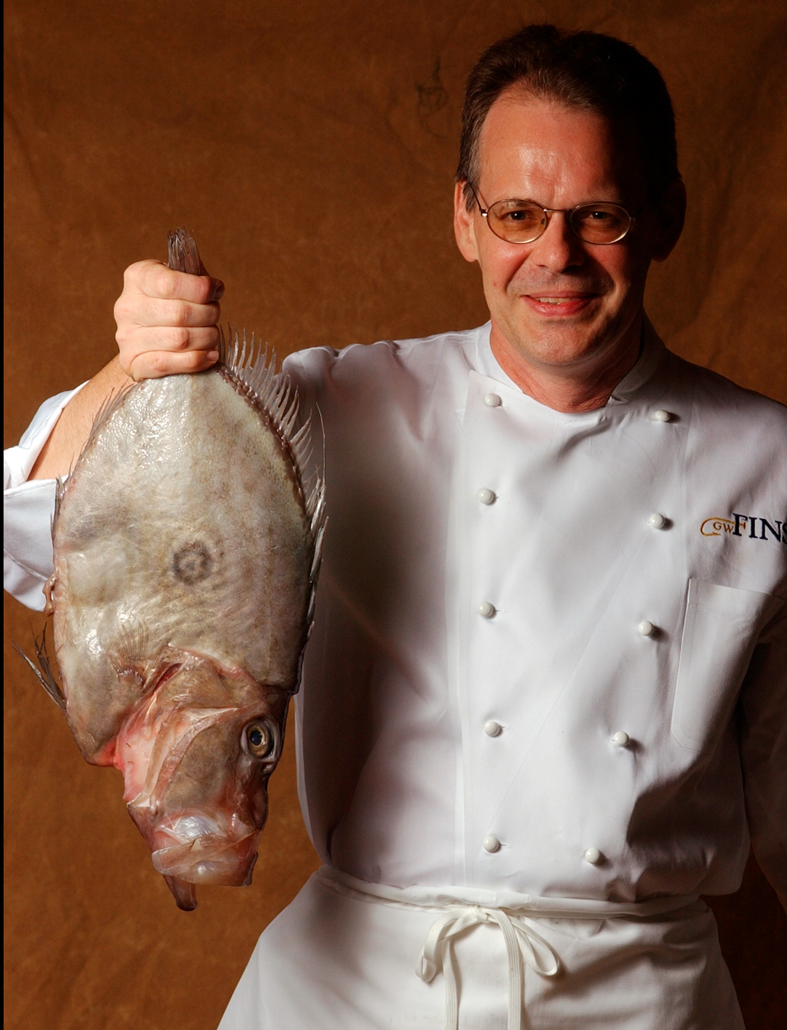Flying Fish: Chef Tenney Flynn with a John Dory fish from New Zeland at G.W. Fins