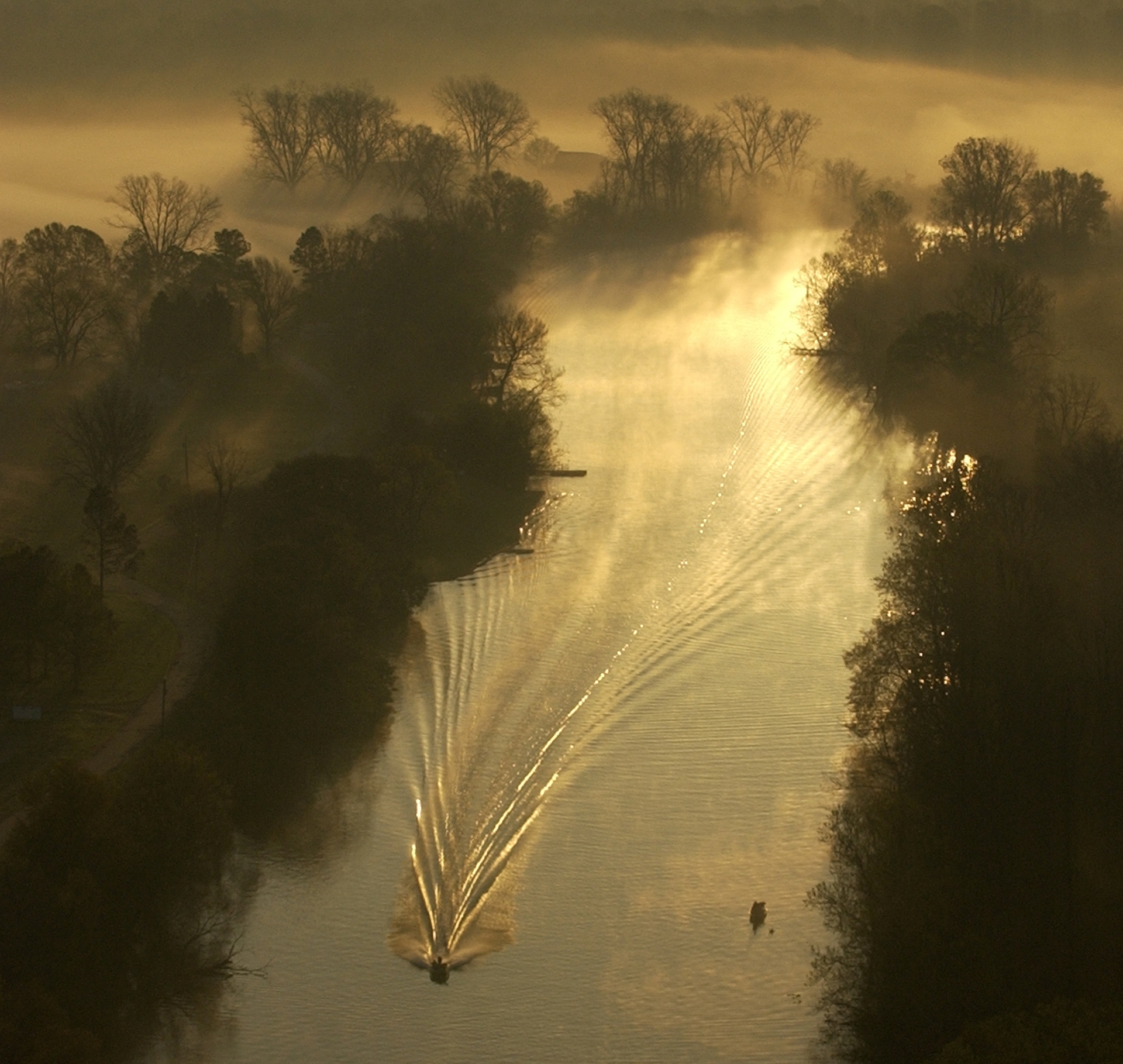 A boat travels down Cane River in Louisiana.
