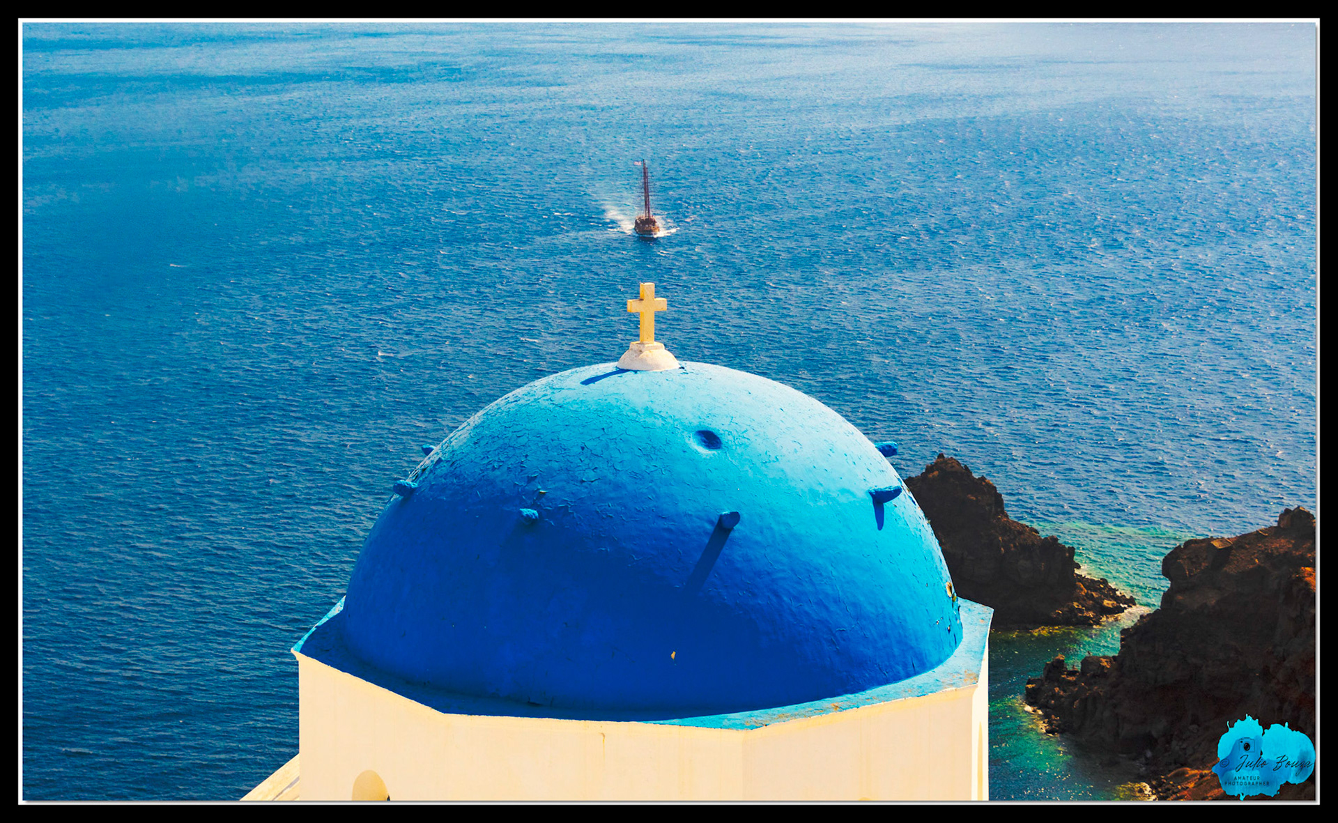 20210806 - View Of A Boat Approaching Oia Village In Santorini From Behind The Resurrection Of The Lord Holy Orthodox Church