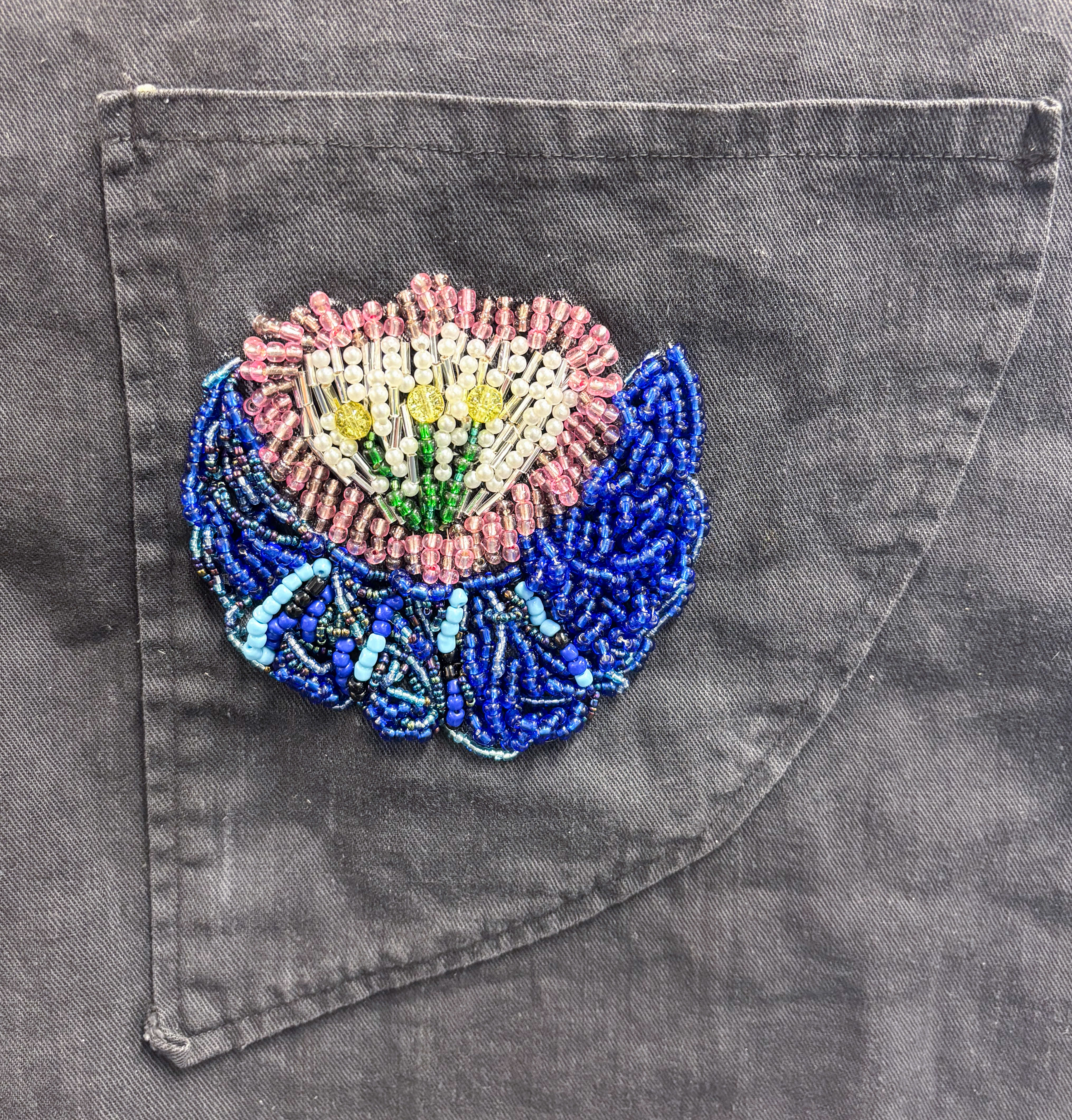 "Grandpa's Memorial Apron"  2025, beading and screen printing on Grandfather's apron