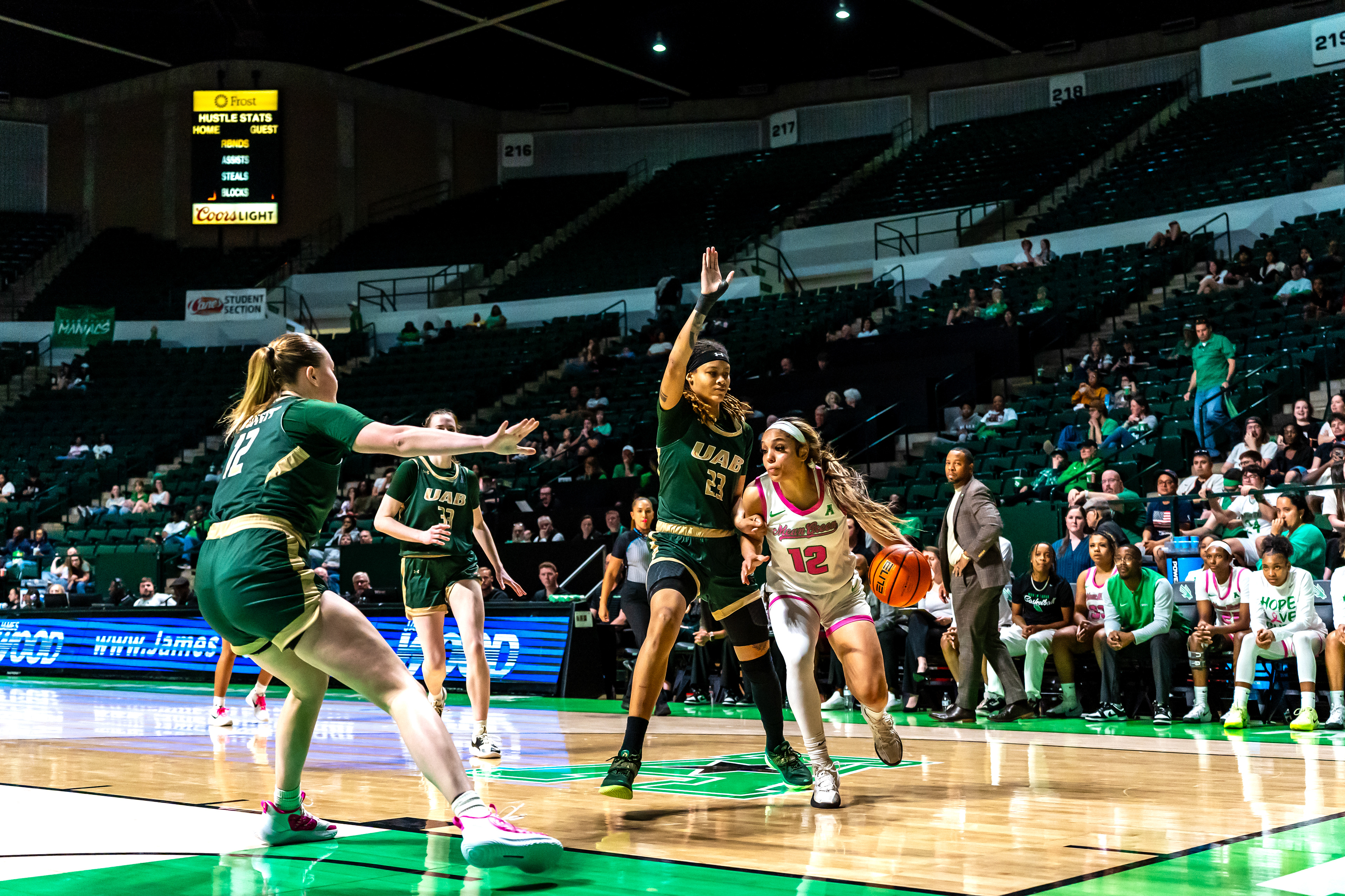 Junior guard Kyla deck dribbles towards the basket during the game against UAB at The Super Pit