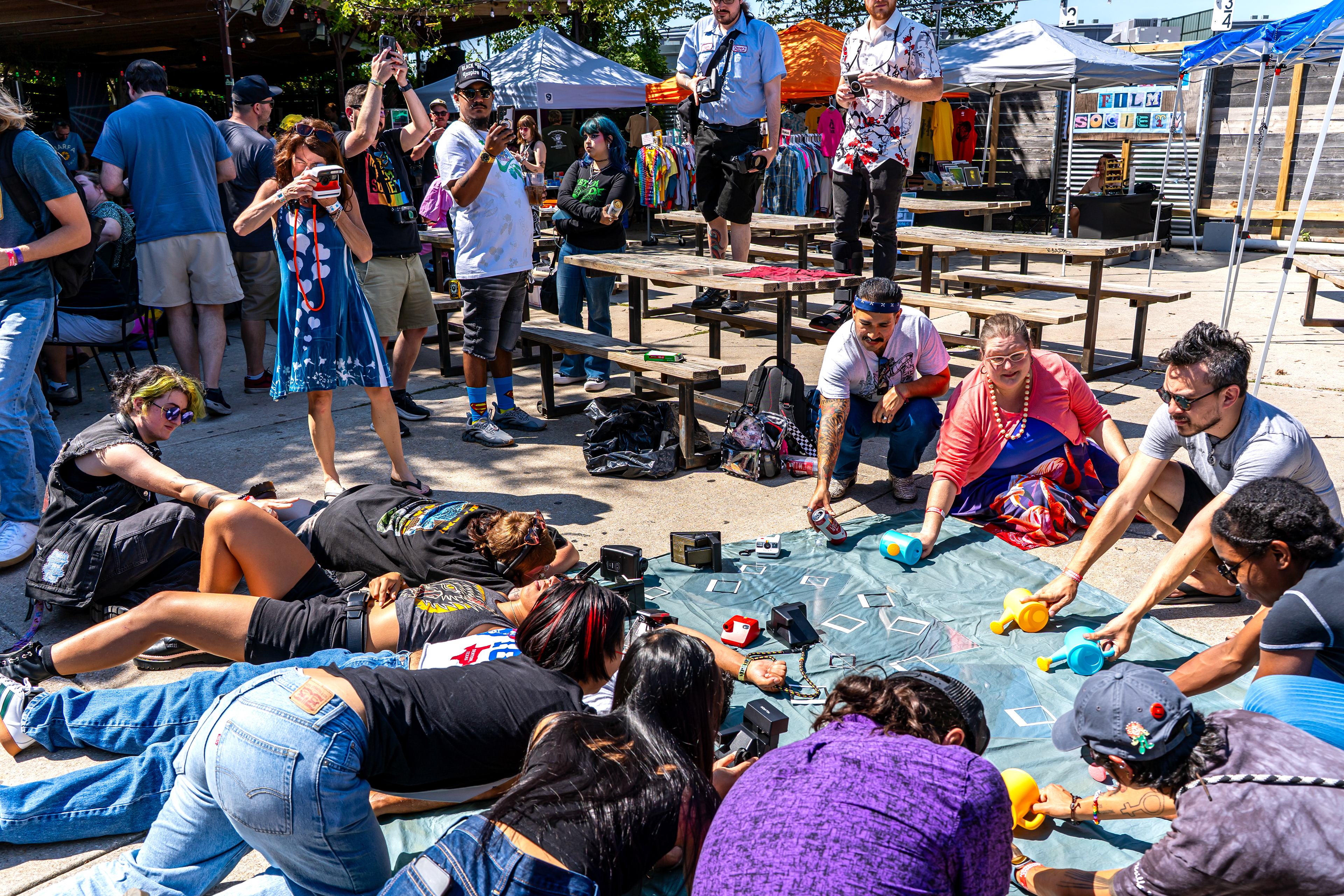 Amy Jasek takes a Polaroid during her large-scale cyanotype workshop.