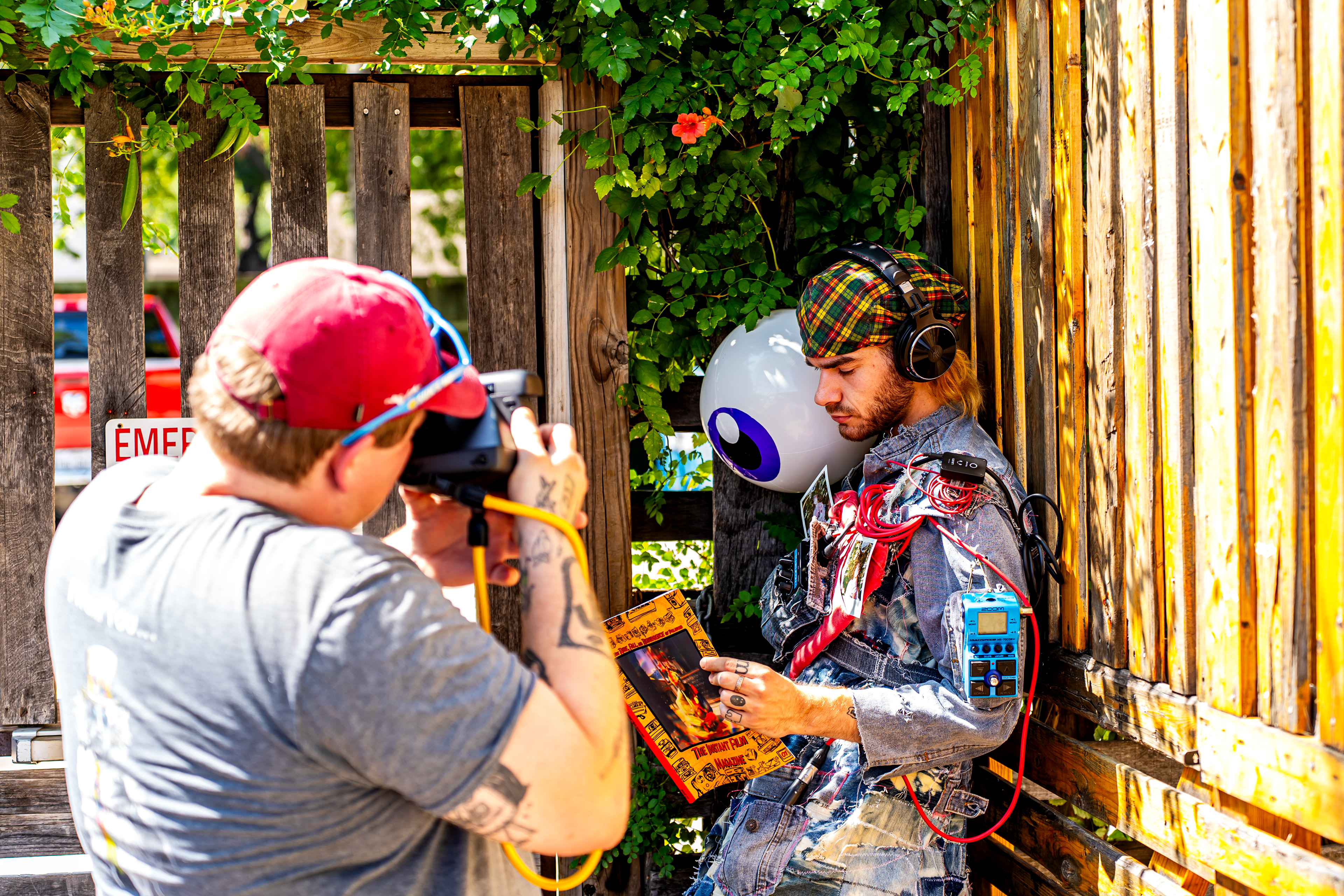 From left: Roy Vice of Instant Film Magazine takes a Polaroid of Nick Mass at Harvest House during Polacon in Denton, TX on Sept. 26, 2025. 
