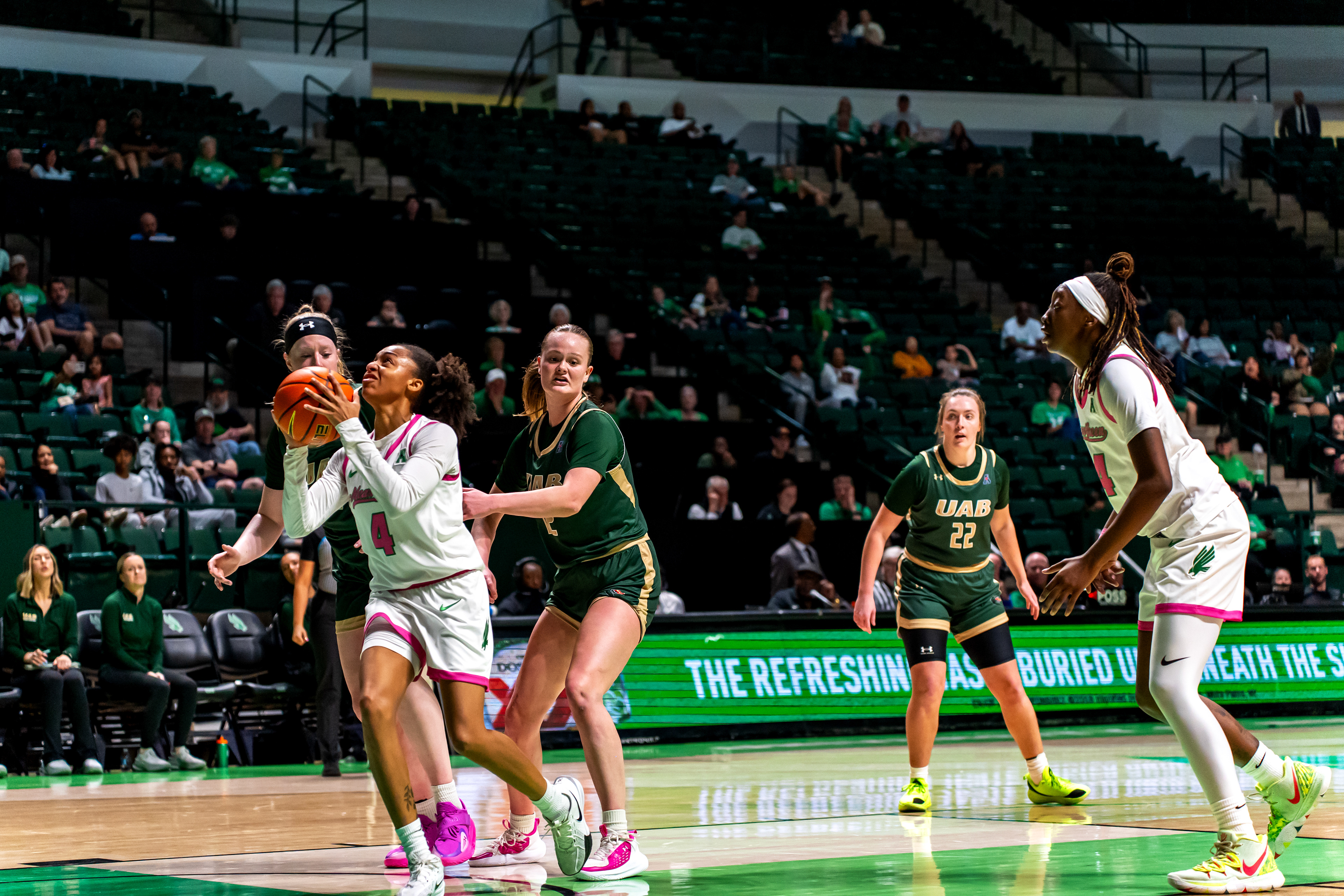 Senior guard Jaaucklyn Moore attempts a layup during the game against UAB at The Super Pit.