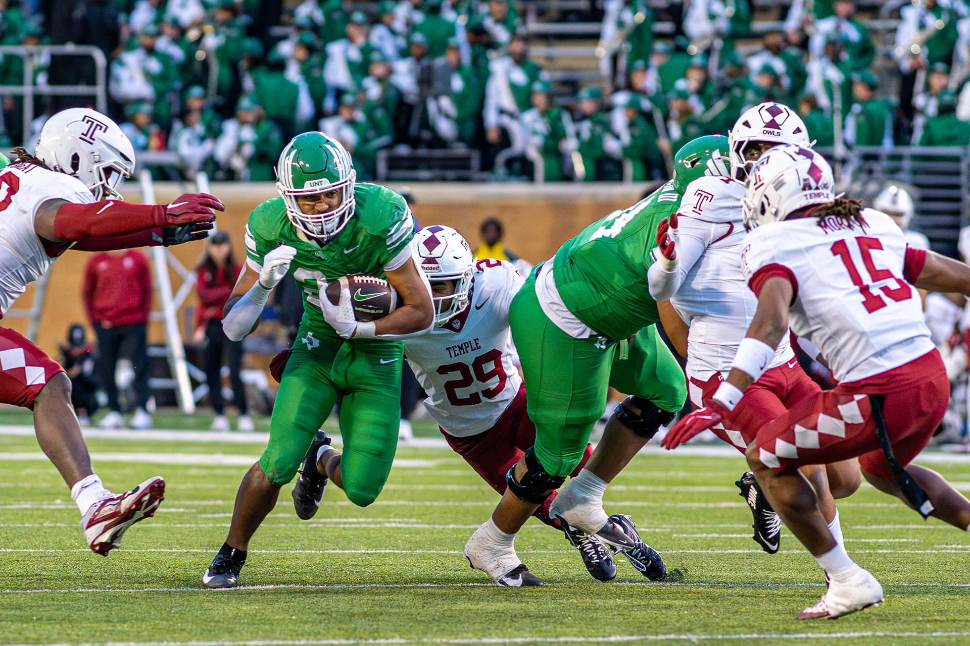 Freshman running back Caleb Hawkins evades defenders against Temple at DATCU Stadium in Denton, TX on Nov. 28, 2025.