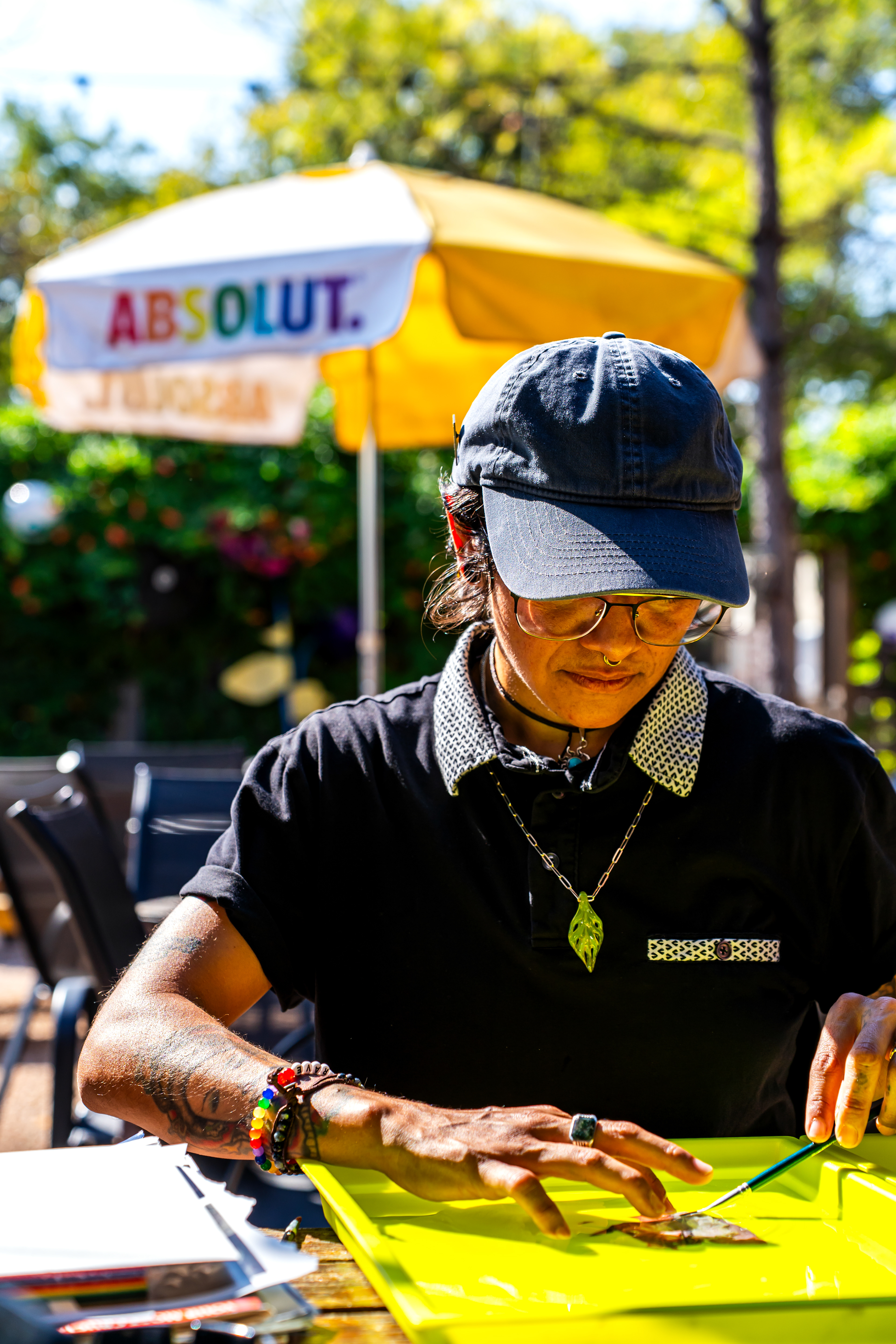Renee Medina transfers the emulsion layer of a Polaroid to cold water during her emulsion lift workshop at Harvest House during Polacon on Sept. 26, 2025. 