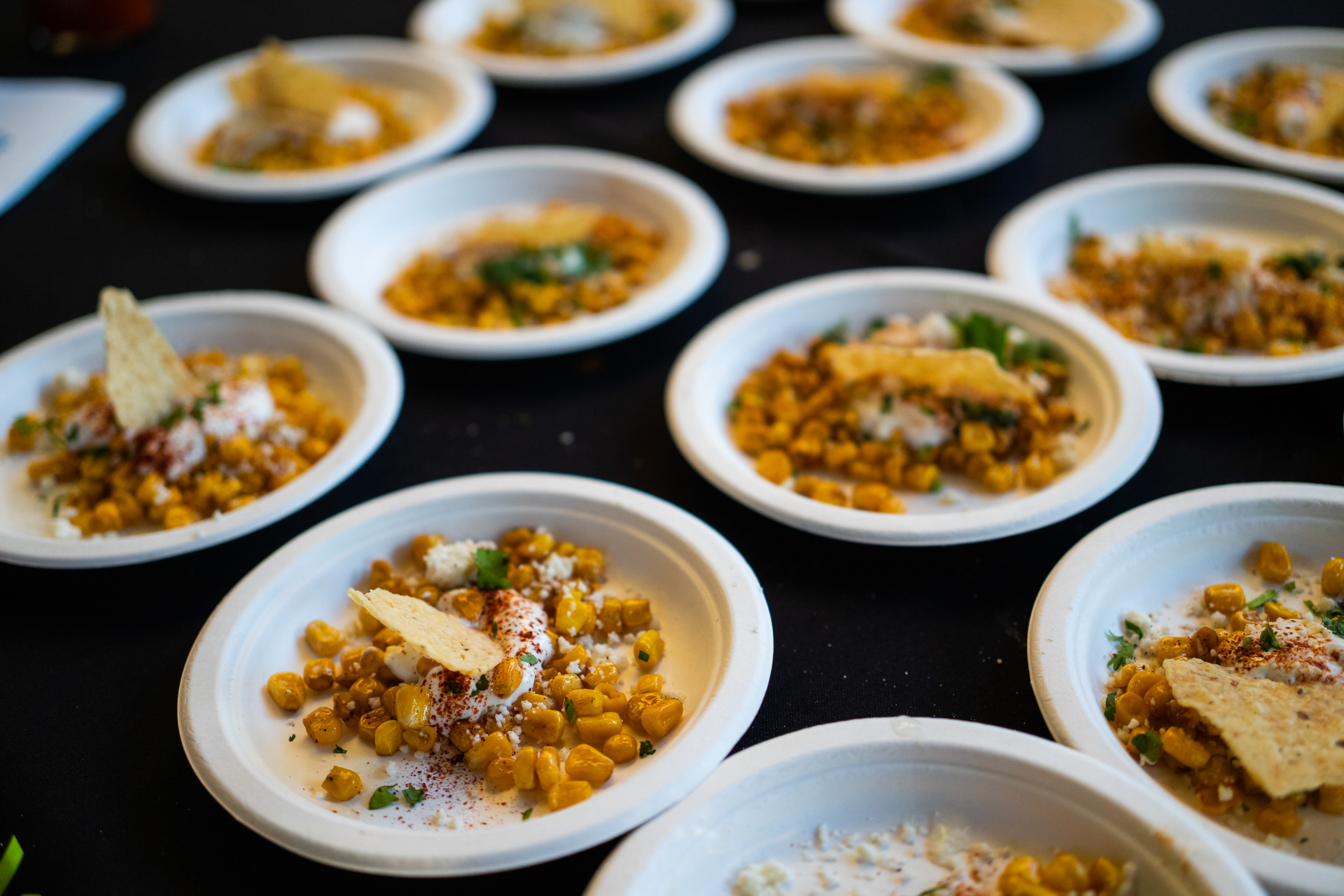 Roasted corn with queso fresco, cilantro and garnished with tostadas.