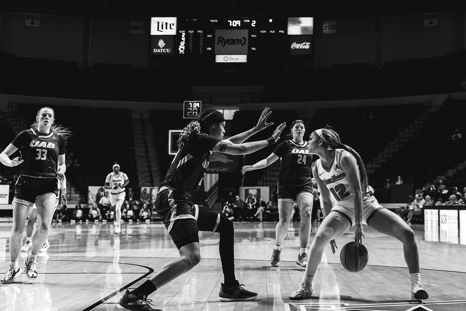 Junior guard Kyla Deck dribbles toward the basket during the game against UAB at The Super Pit in Denton, TX on March 01, 2025. UNT ended up as the winner of the game 56-77. 