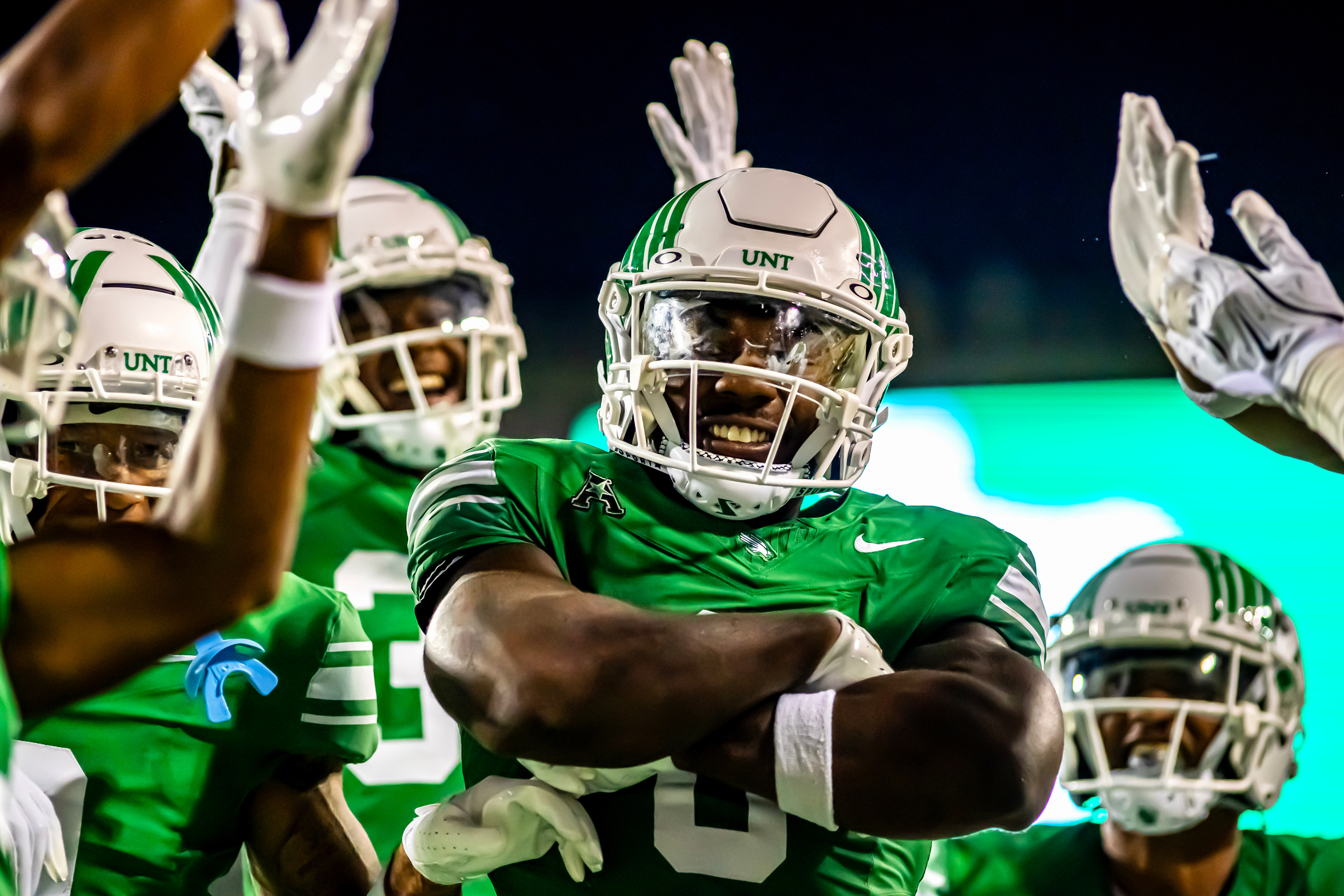 Senior linebacker Trey Fields poses with his teammates after he intercepted a pass at DATCU Stadium on August 30, 2025.