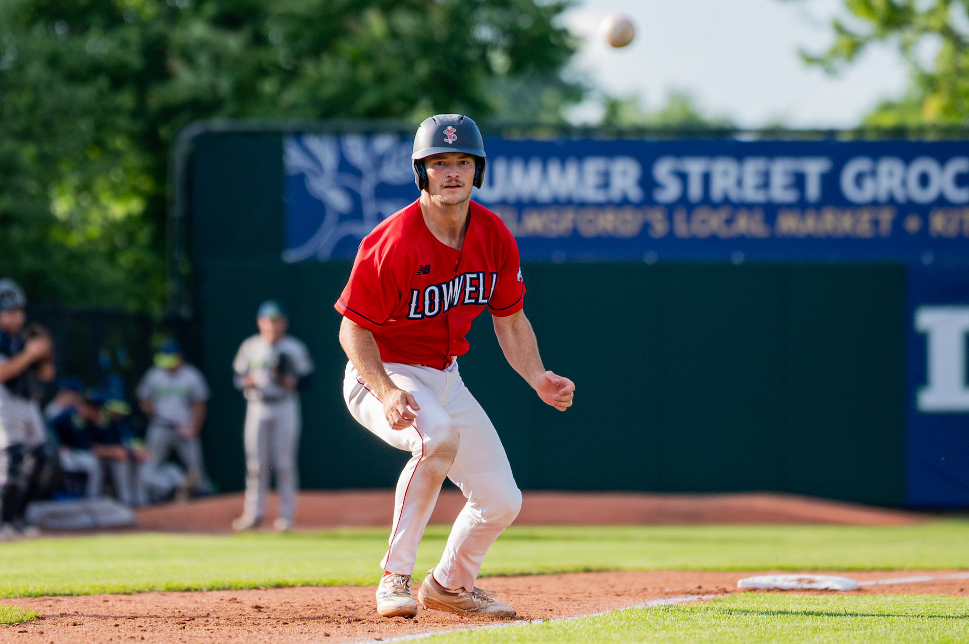 Lowell Spinners' Fletcher Waterman watches the ball fly as he takes a lead from third base. The game was played at Edward A. LeLacheur Park in Lowell, MA, on June 27th, 2026.