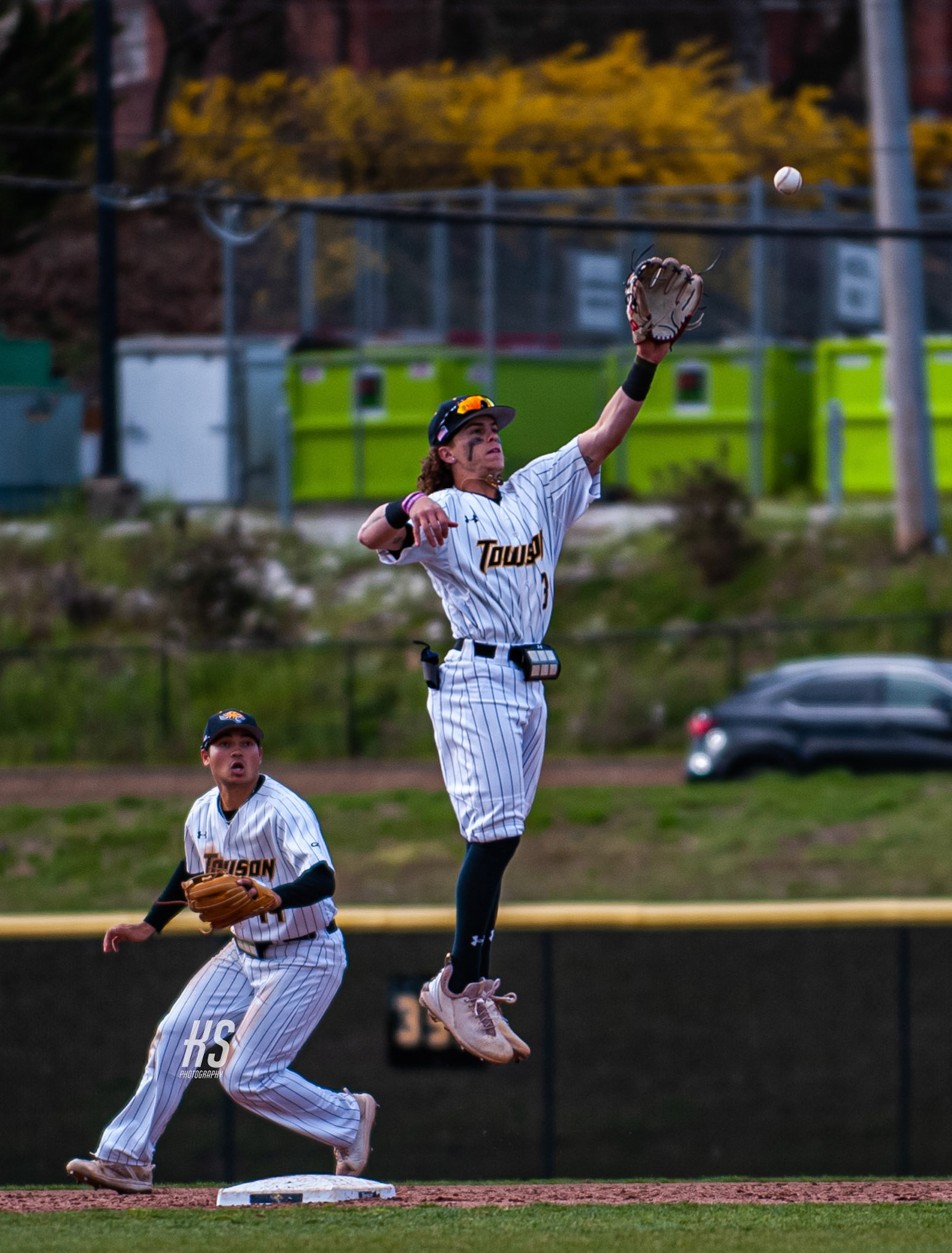 Towson University Baseball infielder Jordan Peyton attempts a leaping catch on a hit from conference rival Elon University during the game at Schuerholz Baseball Complex in Towson, MD, on March 28, 2023.