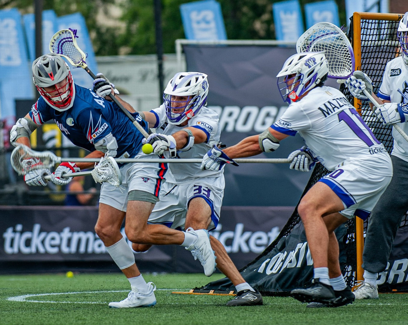 Midfielder Chris Aslanian of the Premier Lacrosse League's Cannons Lacrosse Club attempts a difficult pass while closely guarded by Waterdogs Lacrosse Club defenders during the game at Homewood Field in Baltimore, MD, on August 6, 2023.