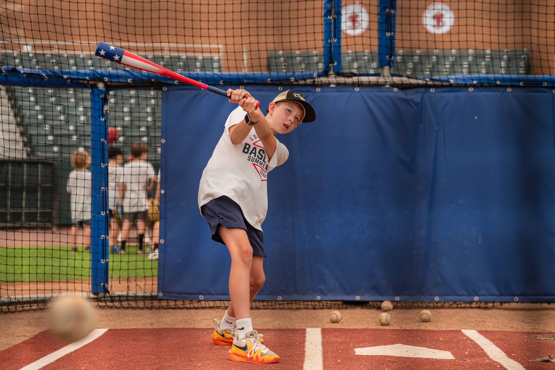 A young Lowell Spinners kids camp attendee gets a hit during the batting section of the camp. This event was held at Edward A. LeLacheur Park in Lowell, MA, on July 15th, 2026.