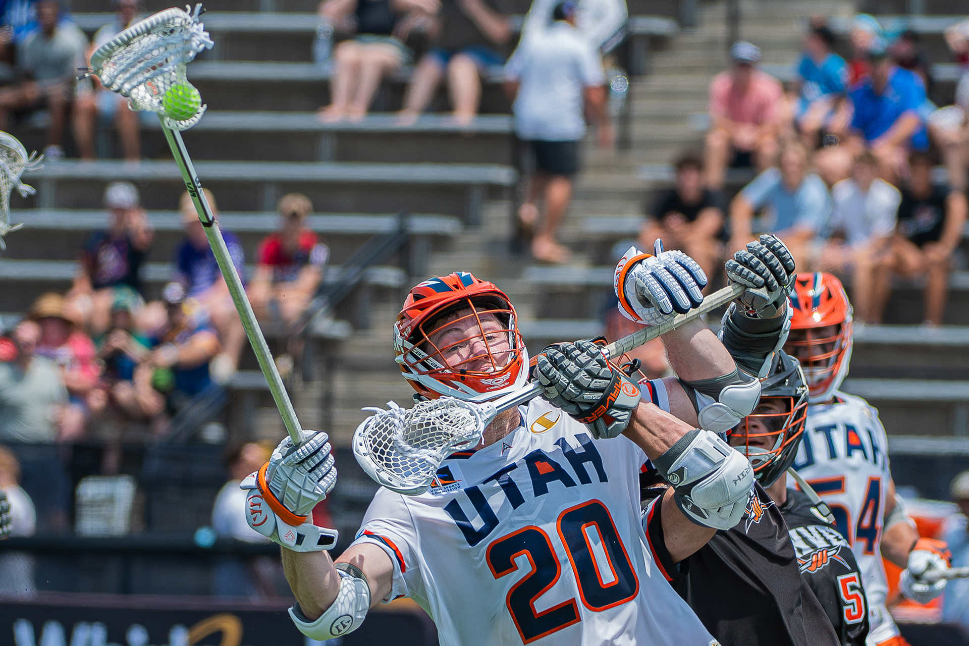 Pat Kavanagh of the Denver Outlaws tries to poke the ball away from Cam Wyers of the Utah Archers during a Premier Lacrosse League game on June 23, 2025, at Homewood Field at Johns Hopkins University in Baltimore. The game was part of the league’s 2025 Baltimore Weekend.