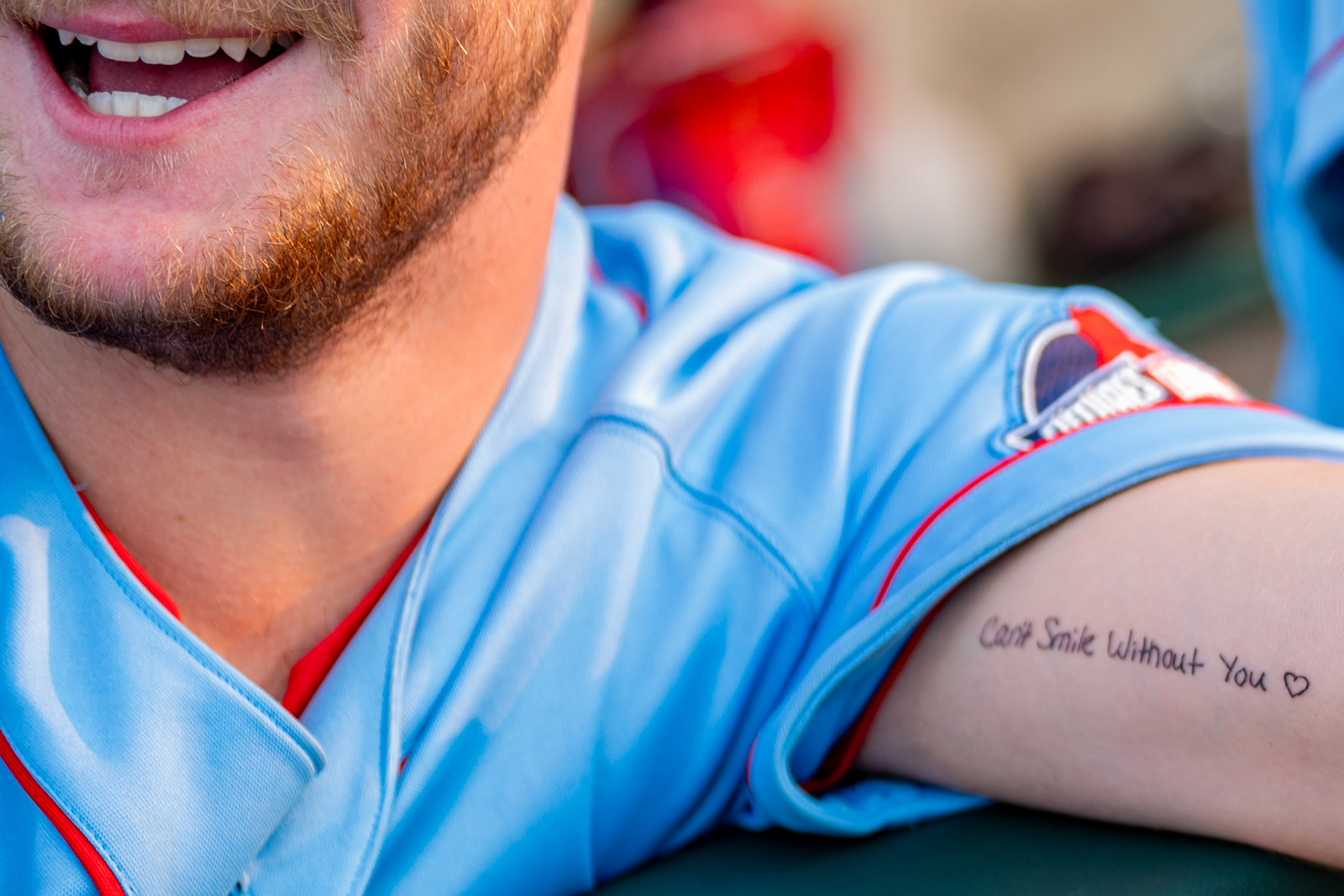 Lowell Spinners' Mikey St. Martin smiles as his tattoo shows the text "Can't smile without you". The game was played at  Edward A. LeLachuer park in Lowell, MA, on July 15th, 2026.