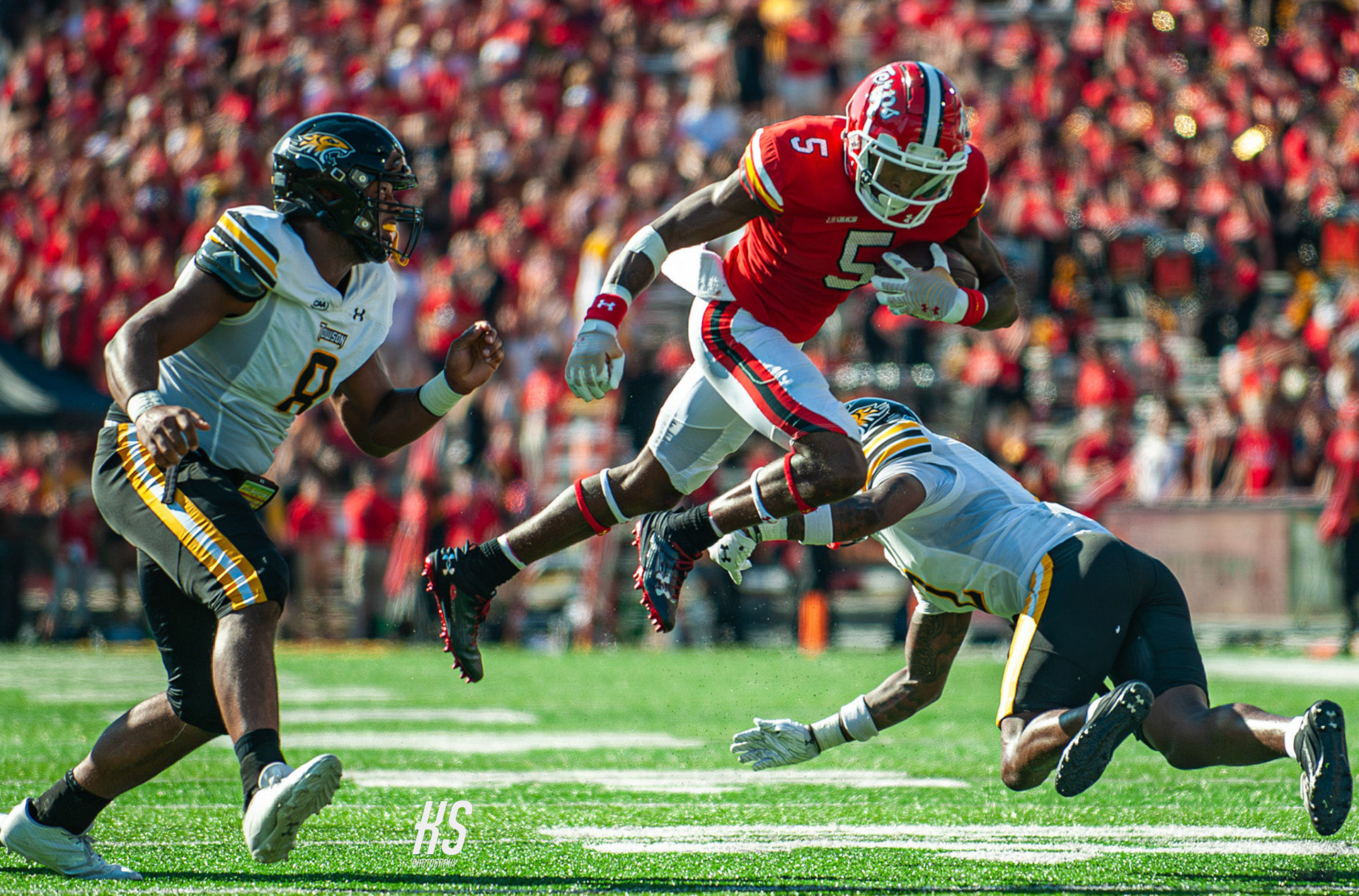 University of Maryland Football wide receiver Octavian Smith Jr. hurdles over a Towson University defender during the game at SECU Stadium in College Park, MD, on September 2, 2024.