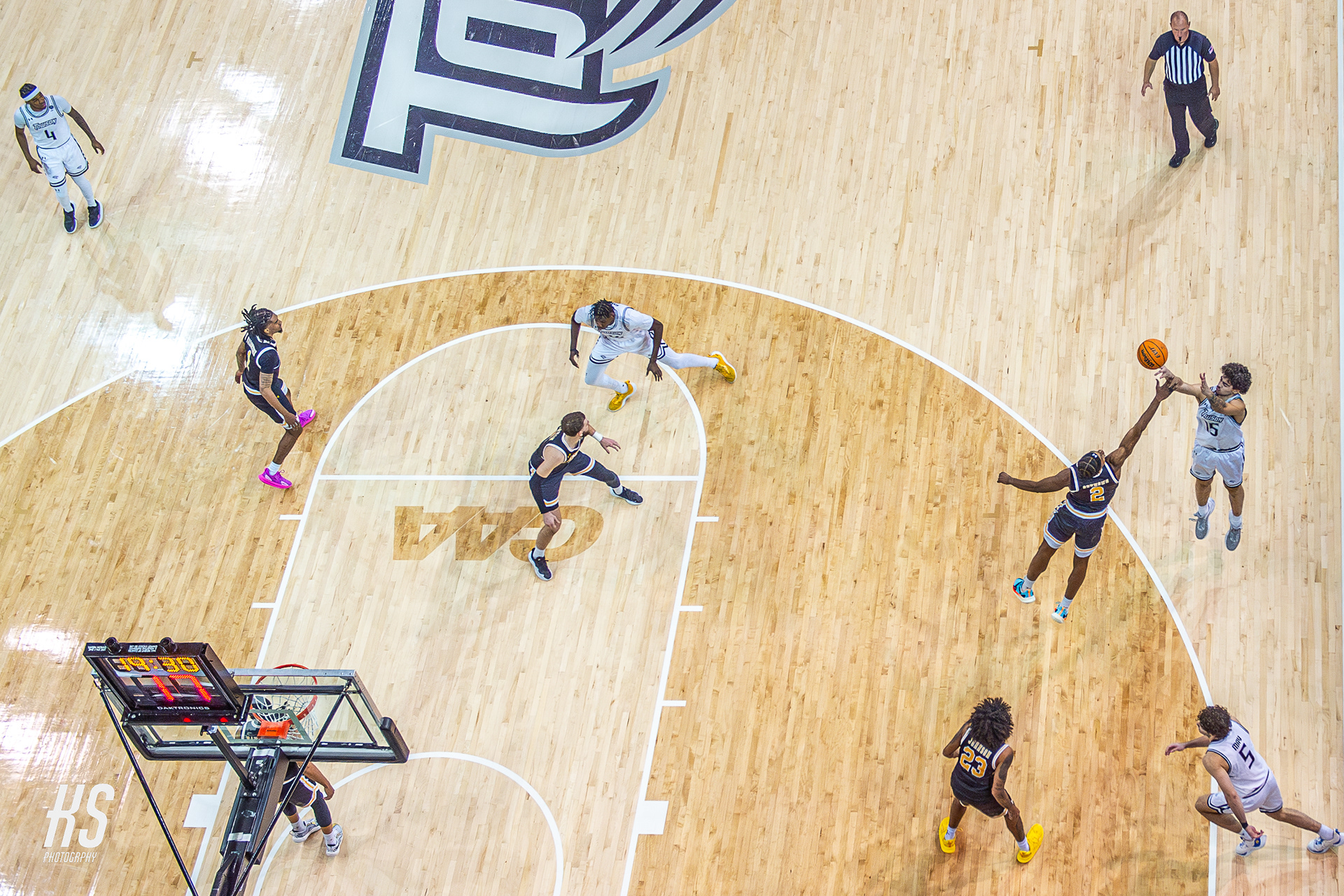 Towson University Men's Basketball forward Tyler Tejada shoots a contested three-point shot against Baltimore County rival University of Maryland Baltimore County during the game at TU Arena in Towson, MD, on December 7, 2024.