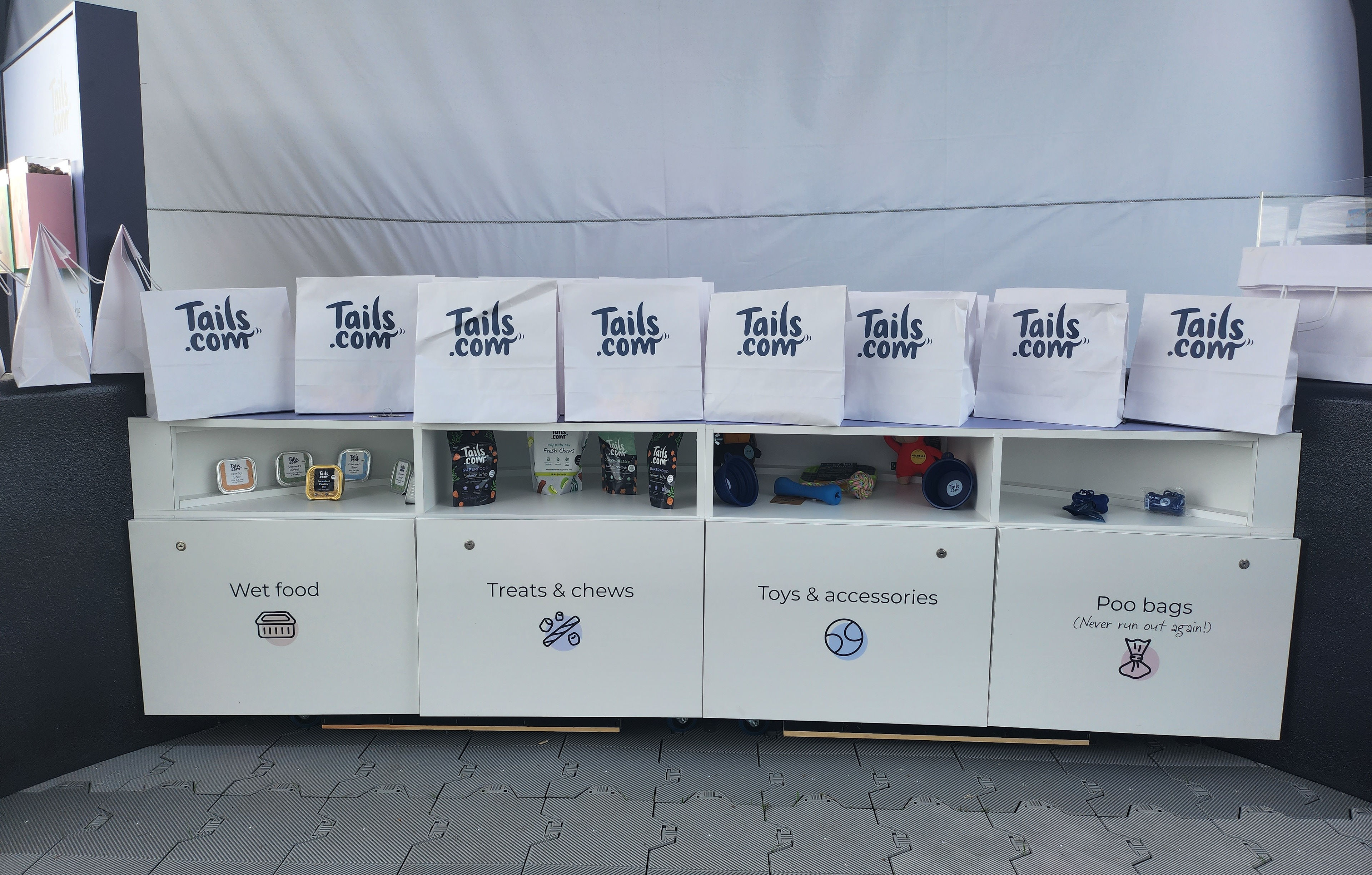 Internal View of One Half of the New Dog Bowl Stand Design Featuring Product Displays and Tails.com Branded Merch