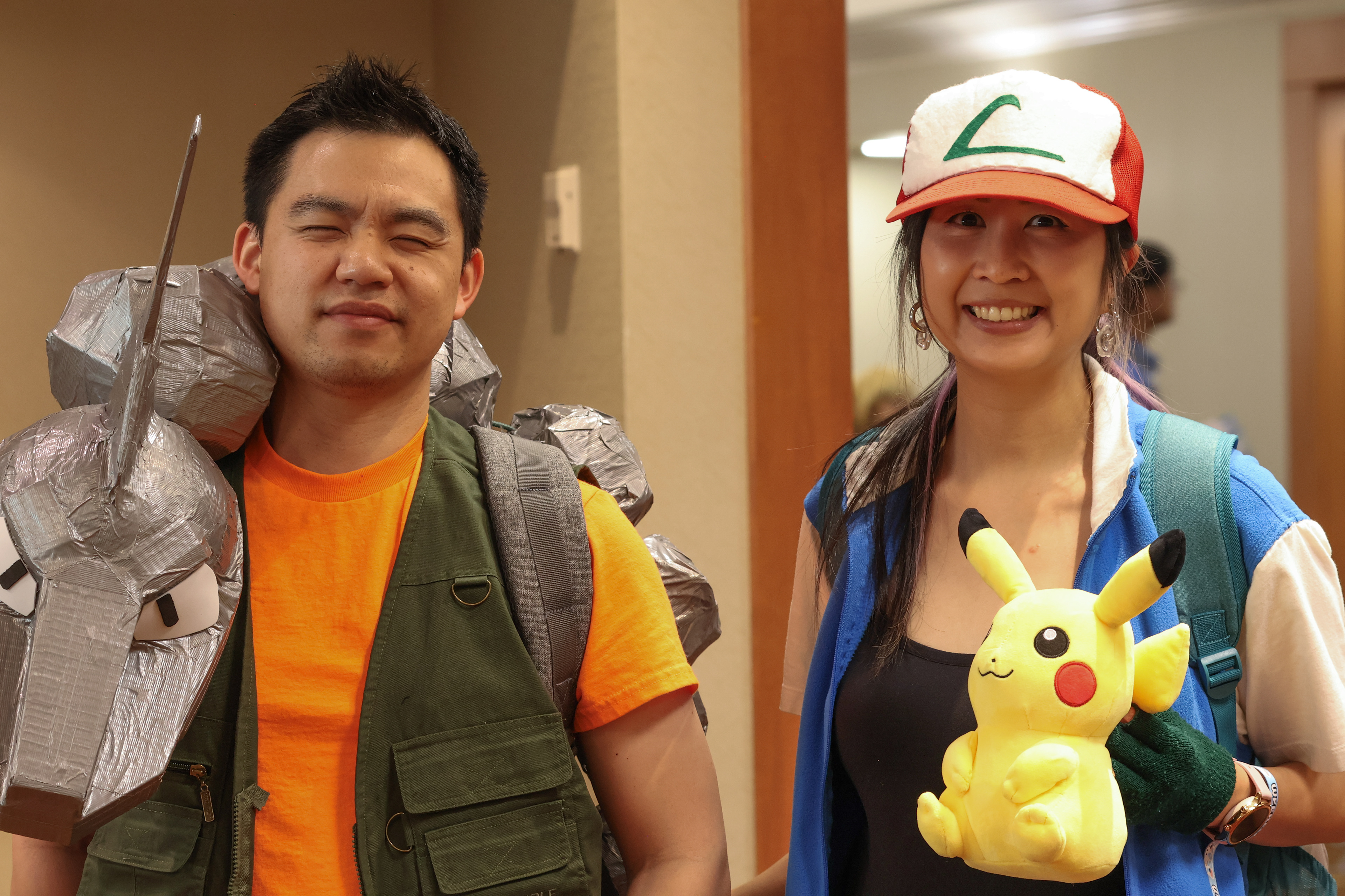 Couple dressed as characters from Pokèmon.