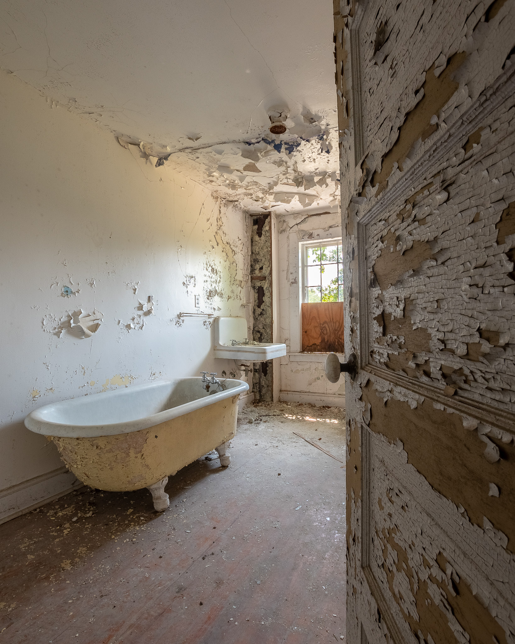 peeling paint and an abandoned bath tub