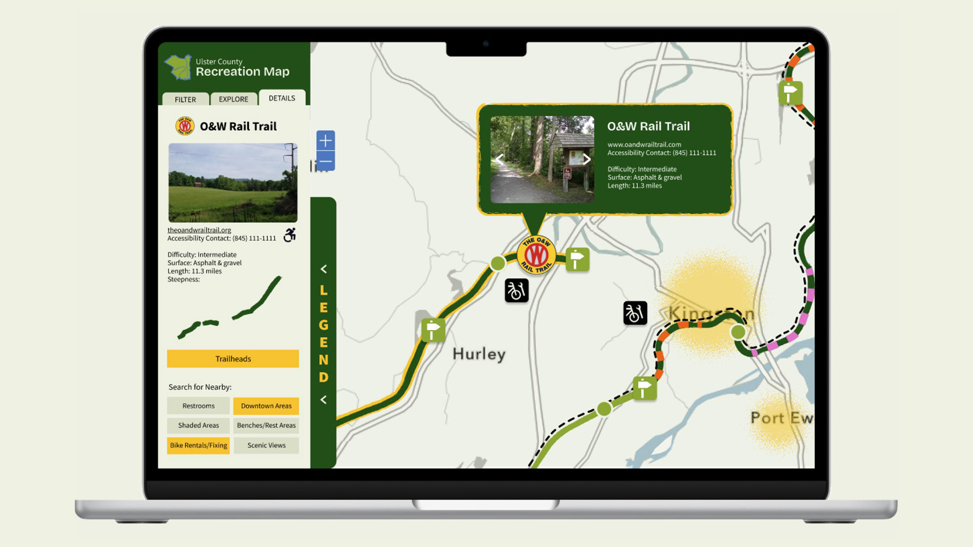 Ulster County Recreation Map application displayed on a laptop, showing the Details tab for the O&W Rail Trail. The left sidebar displays trail info including difficulty (intermediate), surface (asphalt and gravel), length (11.3 miles), a steepness graph, a Trailheads button, and nearby search options. A tooltip on the map highlights the trail's location near Hurley with the same key details.