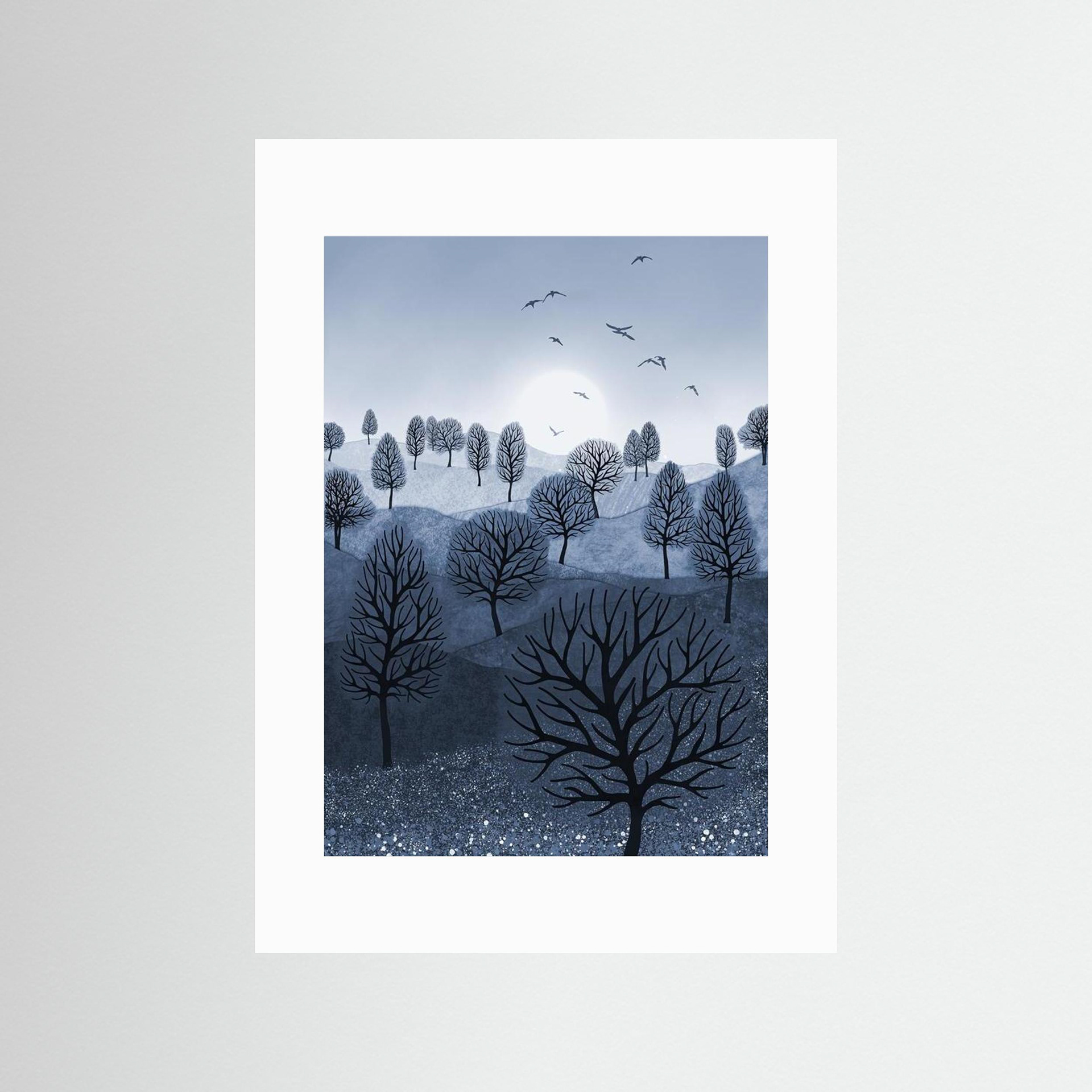 A Splash of Colour 'Blue' created by Robbie William for WalkinHISlight,, artwork depicting a landscape dotted with various trees with the sun shining in the background, with a field of flowers in the foreground and birds flying. Reductive in nature. Shades of white, blue,, through to black.  Available as a canvas print and paper print framed or unframed in various sizes. Contemporary/modern in style..