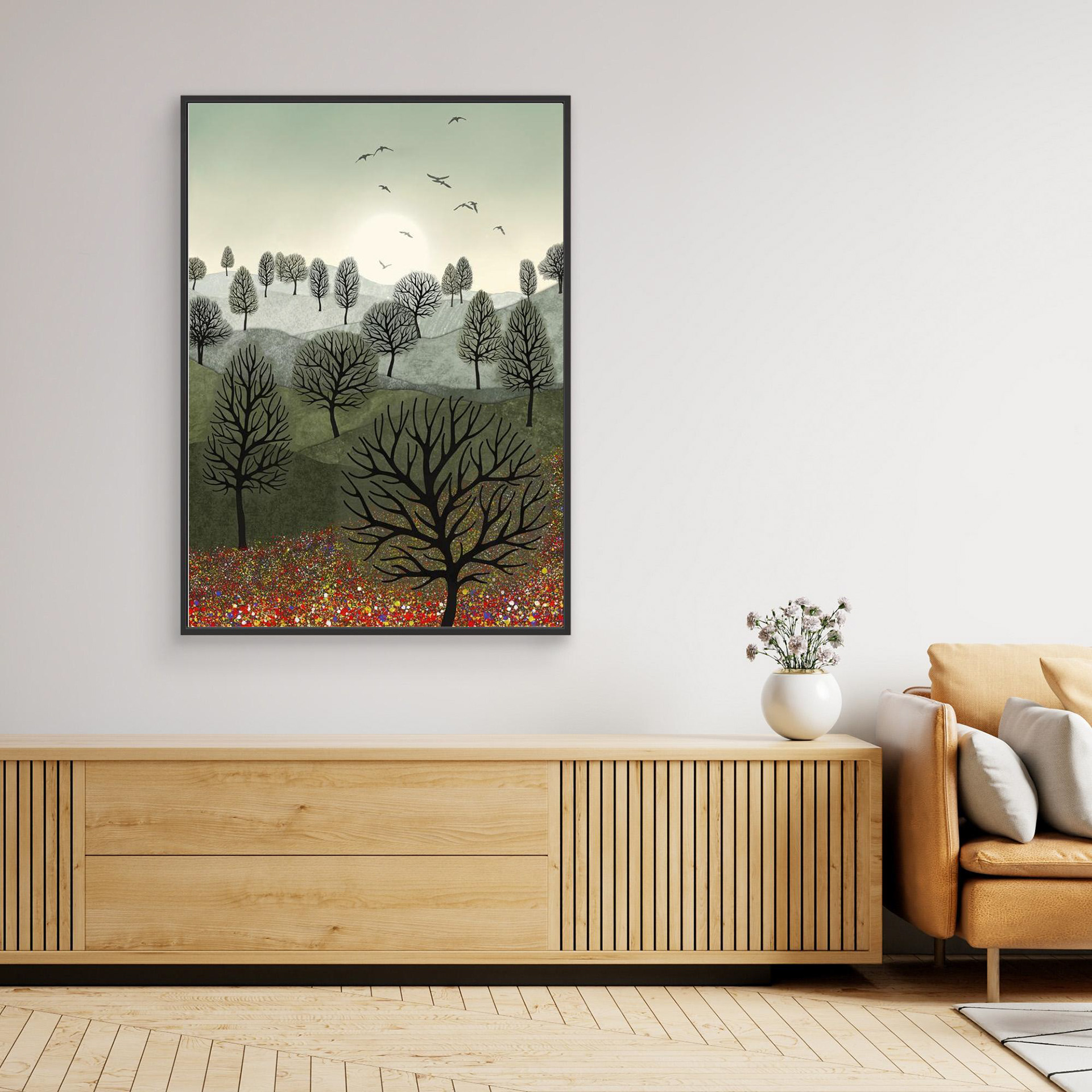 A Splash of Colour created by Robbie William for WalkinHISlight,, artwork depicting a landscape dotted with various trees with the sun shining in the background, with a field of flowers in the forground and birds flying. Reductive in nature. Shades of white, grey's, greens through to black.. Available as a canvas print and paper print framed or unframed in various sizes. Contemporary/modern in style..