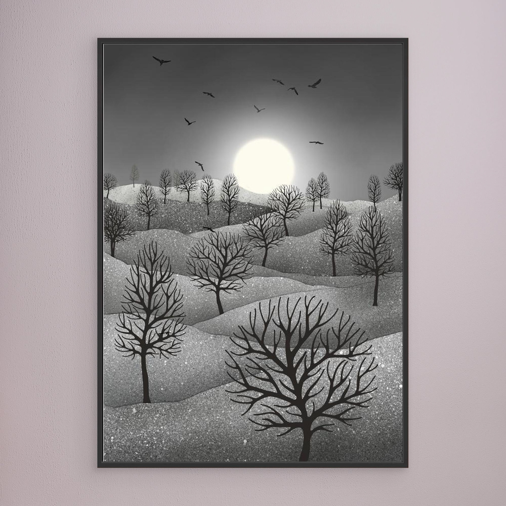 Winter Sparkles, artwork created by Robbie William for WalkinHISlight, depicting a landscape dotted with various trees with the sun shining in the background and birds flying. Reductive in nature. Shades of white, grey through to black.. Available as a canvas print and paper print framed or unframed in various sizes. Contemporary/modern in style..
