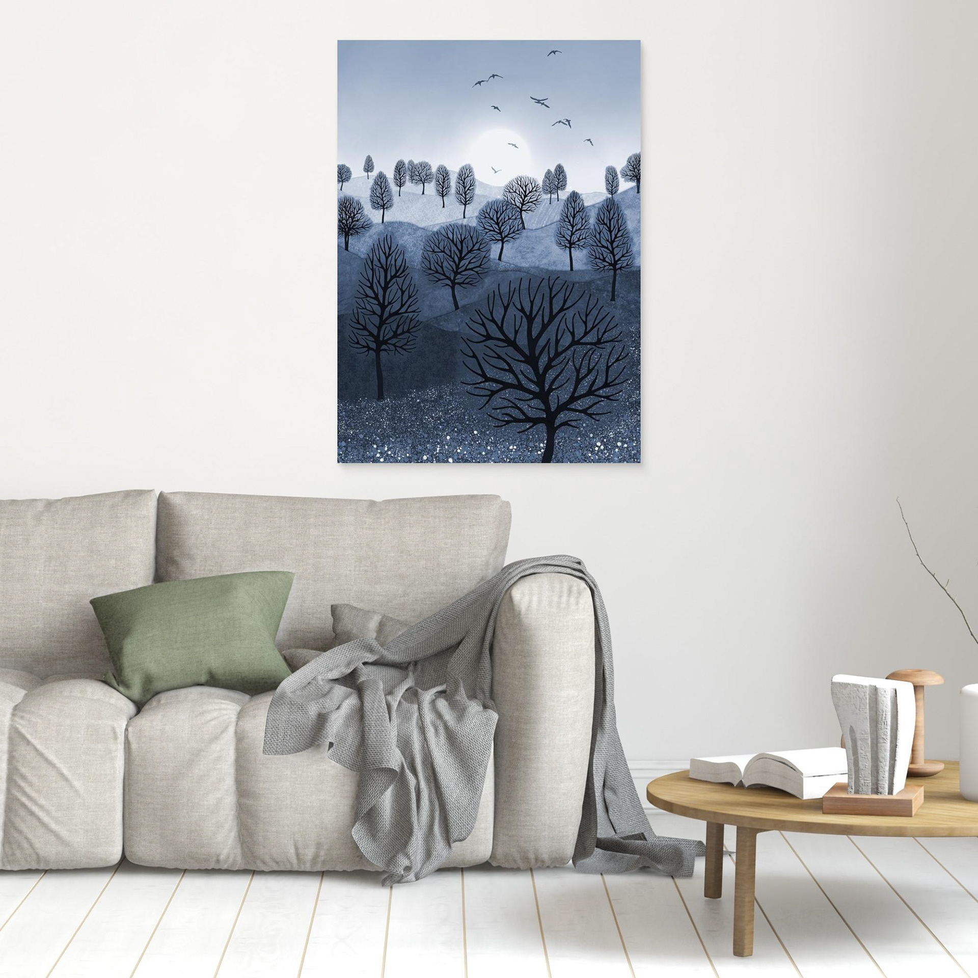 A Splash of Colour 'Blue' created by Robbie William for WalkinHISlight,, artwork depicting a landscape dotted with various trees with the sun shining in the background, with a field of flowers in the foreground and birds flying. Reductive in nature. Shades of white, blue,, through to black.  Available as a canvas print and paper print framed or unframed in various sizes. Contemporary/modern in style..