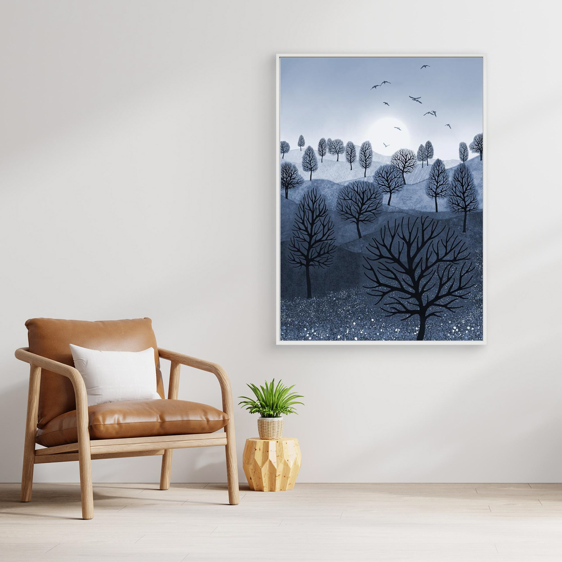 A Splash of Colour 'Blue' created by Robbie William for WalkinHISlight,, artwork depicting a landscape dotted with various trees with the sun shining in the background, with a field of flowers in the foreground and birds flying. Reductive in nature. Shades of white, blue,, through to black.  Available as a canvas print and paper print framed or unframed in various sizes. Contemporary/modern in style..