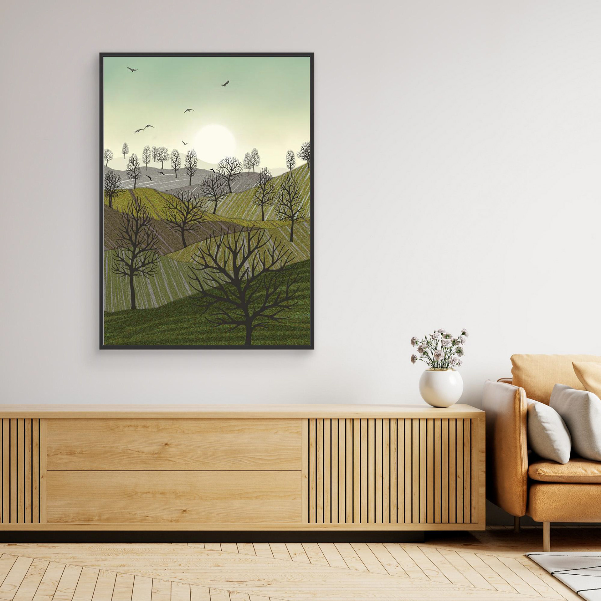 Over the Hills created by Robbie William for WalkinHISlight,, artwork depicting a landscape dotted with various trees with the sun shining in the background and birds flying. Reductive in nature. Shades of white, grey's, greens through to black.. Available as a canvas print and paper print framed or unframed in various sizes. Contemporary/modern in style..