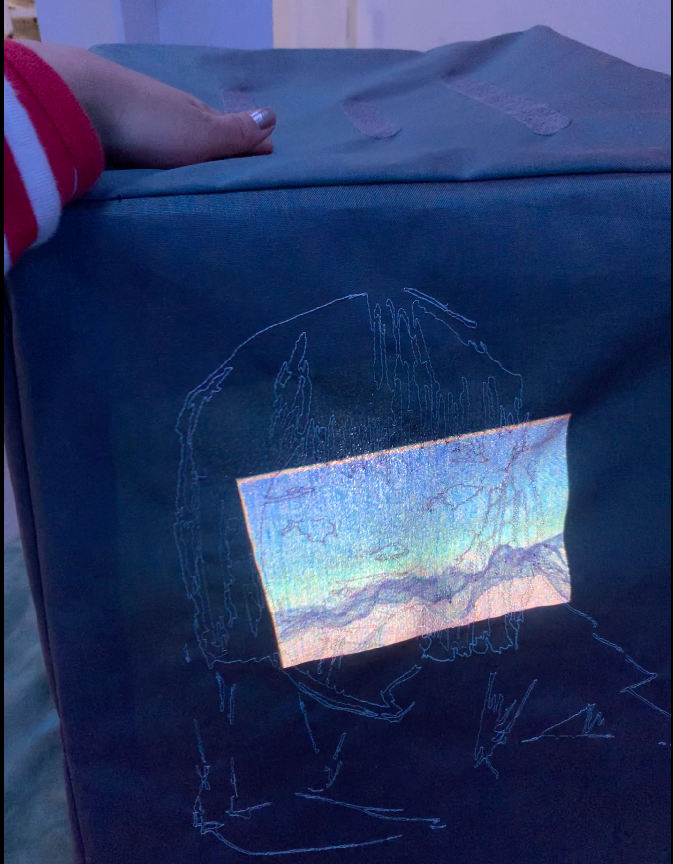 Detail shot of embroidery and AR projection