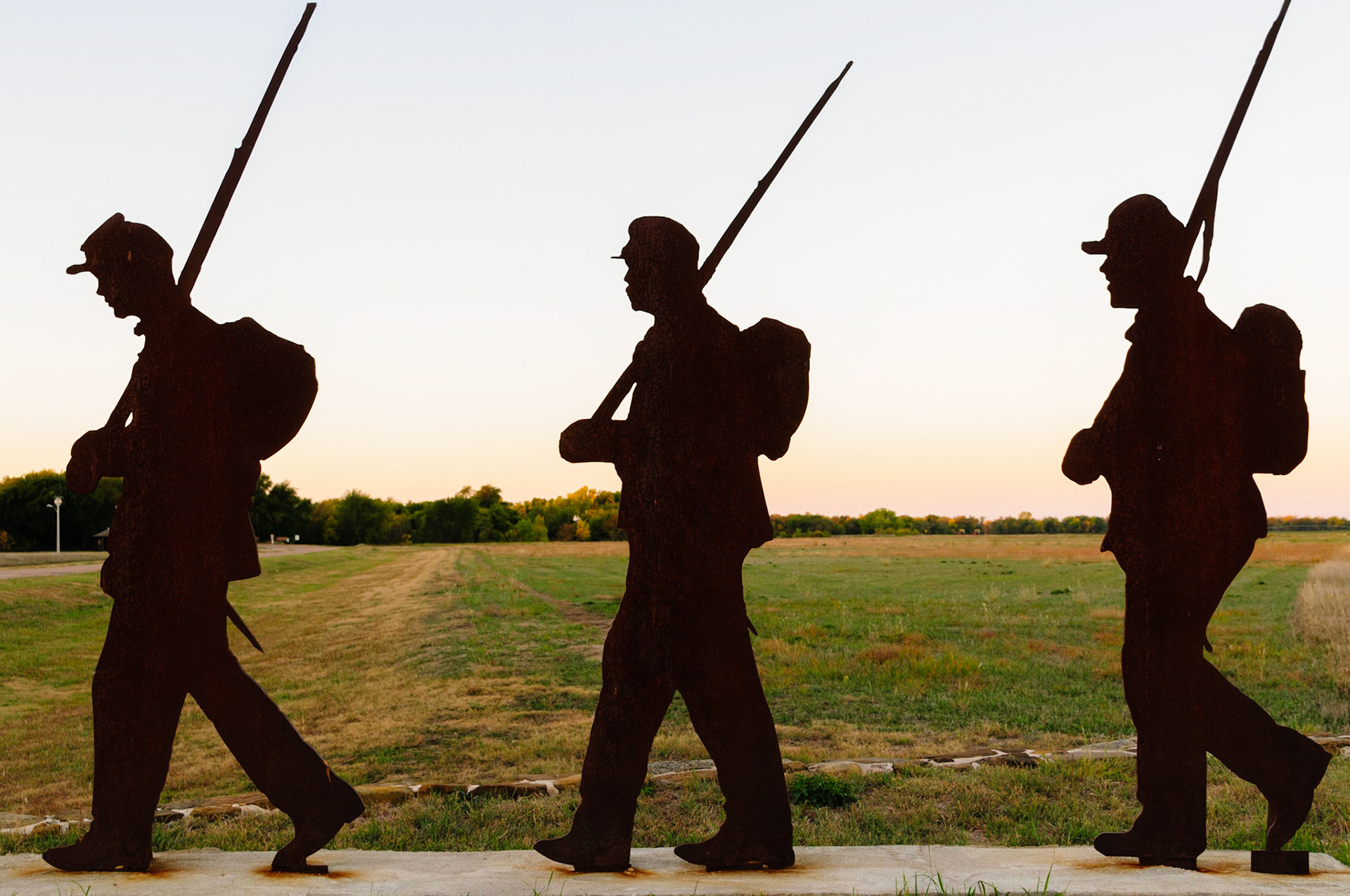 Fort Larned was established in 1859 and situated directly on the “Dry Route” of the Sana Fe trail. The fort was initially staffed by the officers and men of the 1st U.S. Cavalry and the 2nd U.S. Infantry, and subsequently, the 2nd U.S. Dragoons in 1860. The fort, which is currently managed by the National Park Service (NPS) as a National Historic Site (NHS), became known as the “Guardian of The Santa Fe Trail”. The steel plate sculpture pictured here stands as monument at the park entrance.