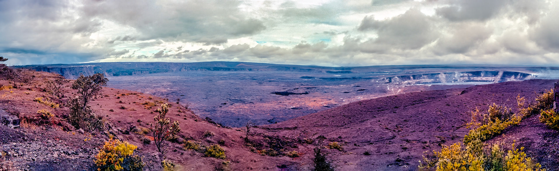 Partial view of Kilauea Crater looking approximately Southeast from the Kilauea Overlook in Hawaii Volcanoes NP (National Park). A few fumaroles can be seen in the caldera of the Kilauea Crater, and the Hale Ma'uma'u Volcano Crater is seen in the left center of this three-color-negative panorama.Three images captured on Kodak Royal Gold 100 color negative film. After scanning Them with an Epson Perfection V750 PRO using Silverfast software, the ColorPerfect Plugin from CFSystems converted the negative images to positive images in Photoshop. Post-processing completed in Lightroom Classic after merging the photos into a panorama in Photoshop.