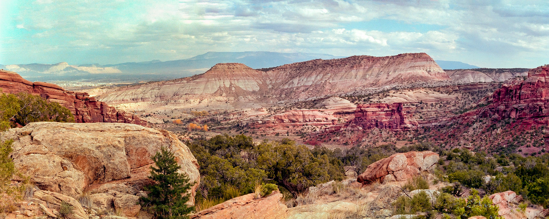View from No Thoroughfare Canyon looking back toward the East entrance of the park. A portion of Grand Junction can be seen in the upper left of the image.