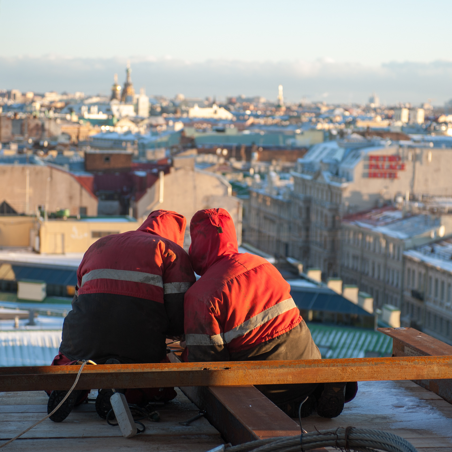 Builders on a roof