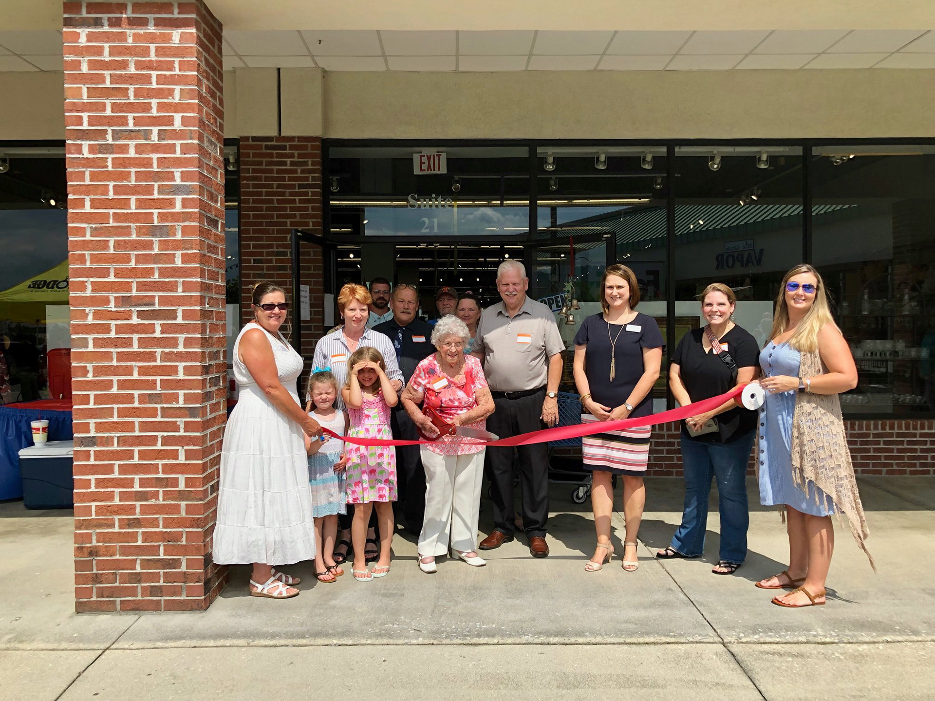 Reopening ribbon cutting · Lighting the Way Outreach