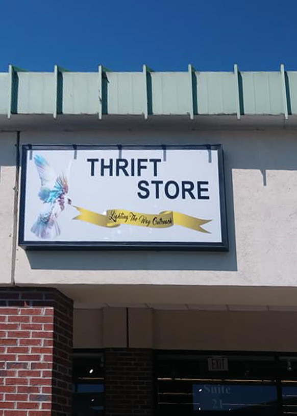 Outreach identity applied to storefront signage