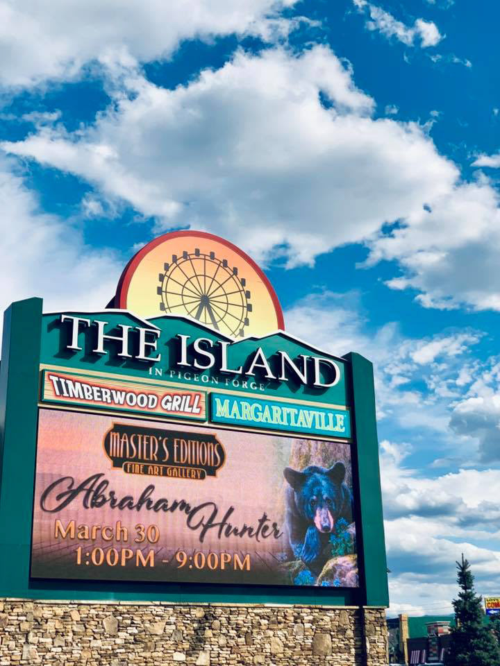 Artist-event promotion at The Island · Campaign design translated into digital signage