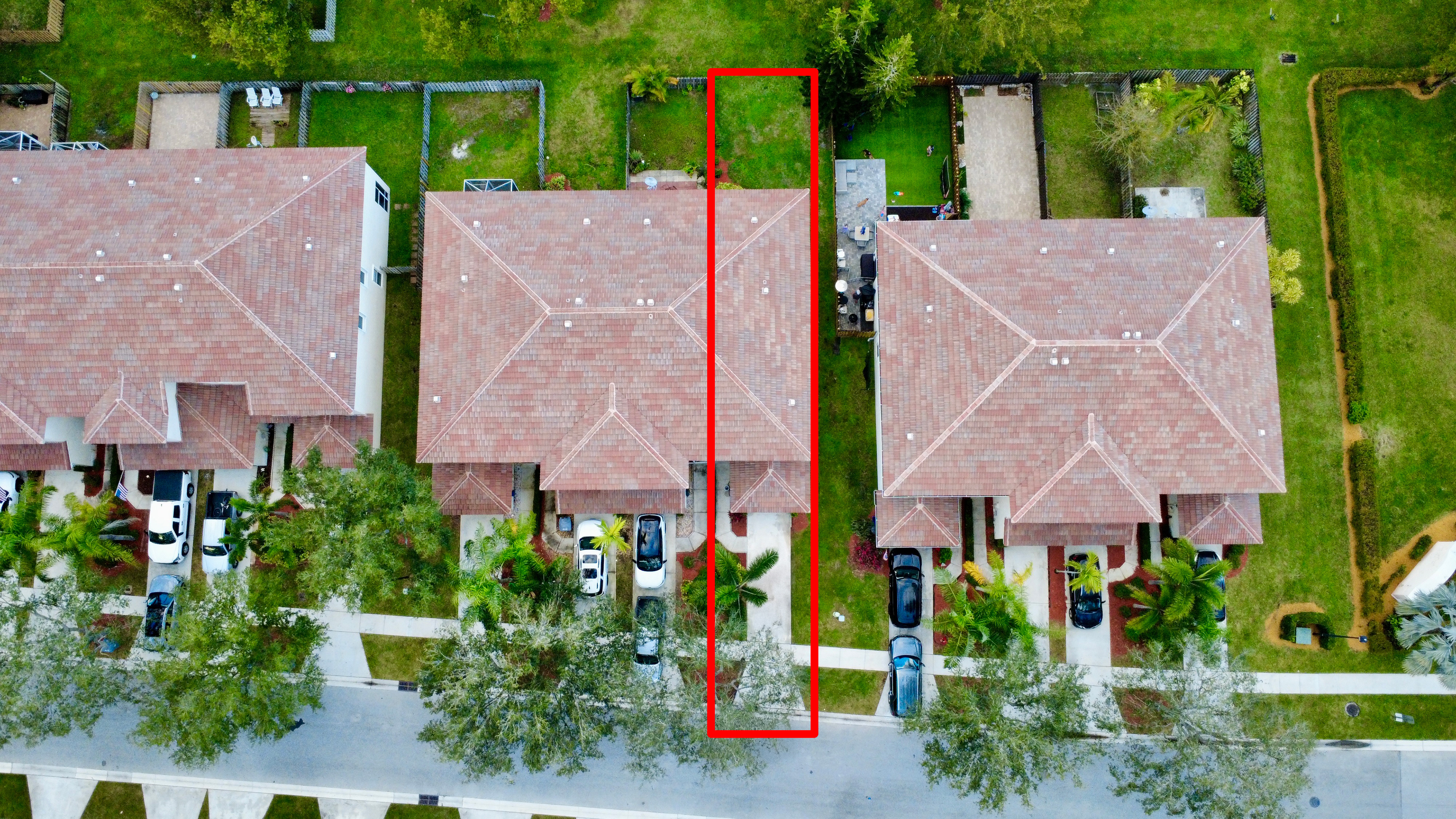 Aerial composition capturing the entire property footprint including parking, access, and exterior features.