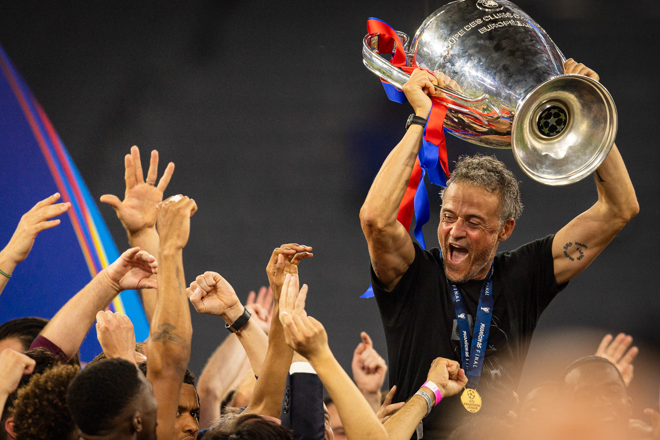 Coach Luis Enrique of Paris Saint Germain celebrates with his team mates their victory lifting the trophy at the UEFA Champions League final match against FC Internazionale Milano in Munich, Germany
