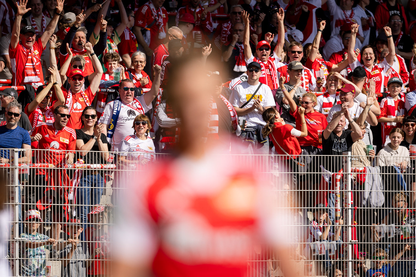 Fans of 1. FC Union Berlin celebrate their team's goal during a 2.nd Bundesliga match, at the Stadion an der alten Försterei, in Berlin, Germany